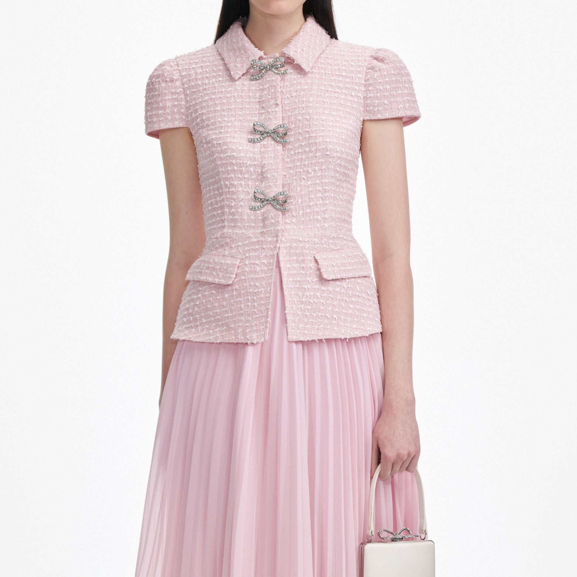 A close up of a woman wearing the Pink Boucle Midi Dress