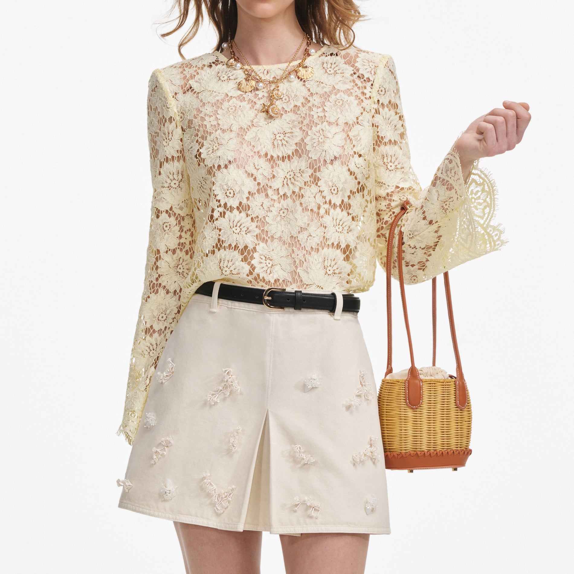 A close up of a woman wearing the Yellow Lace Fluted Sleeve Top