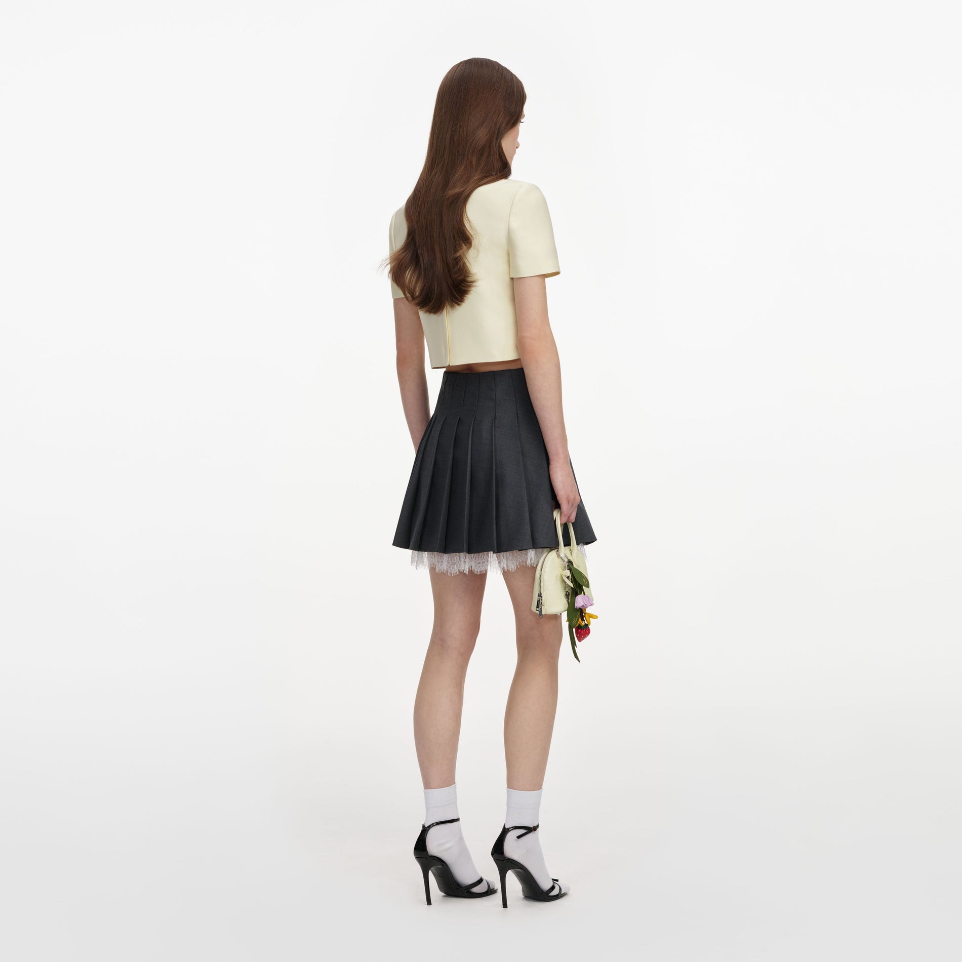 Back view of a woman wearing the Yellow Taffeta Top