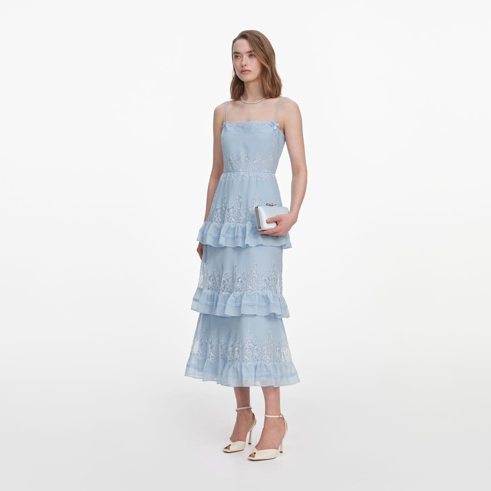 Side view of a woman wearing the Blue Chiffon Lace Tiered Midi Dress