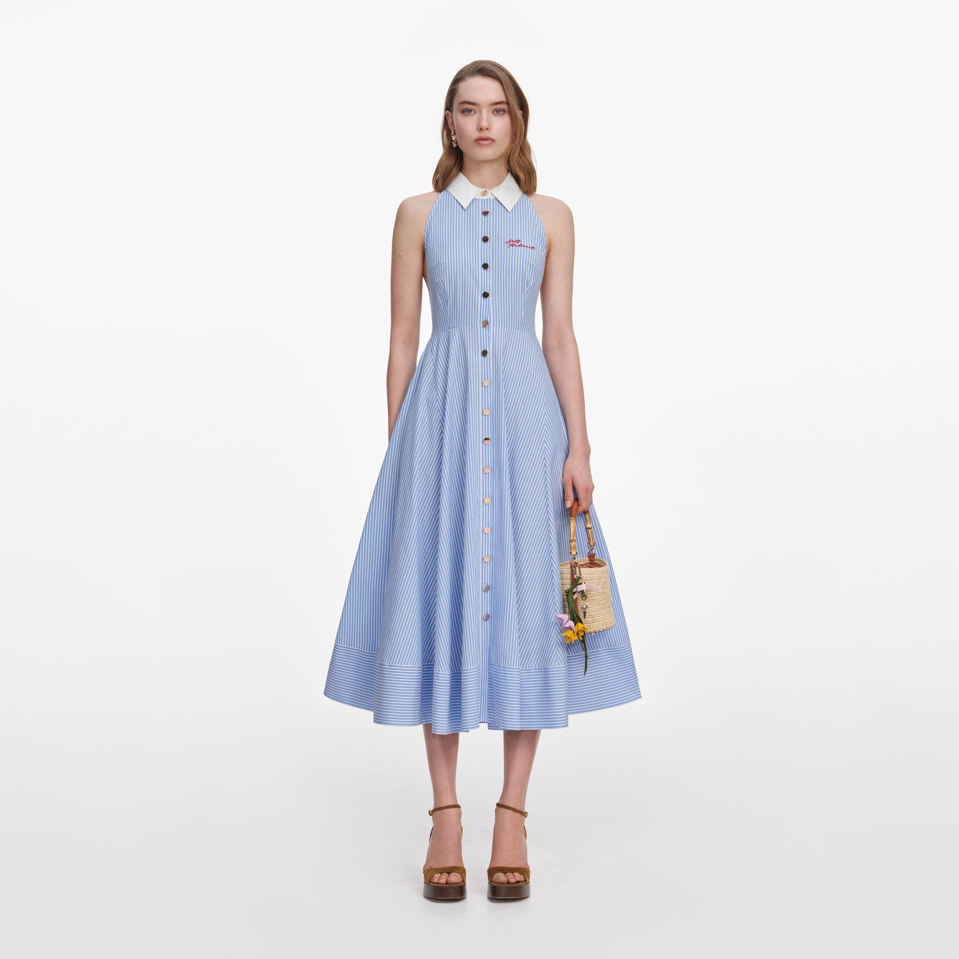 Front view of a woman wearing the Blue Striped Cotton Midi Dress