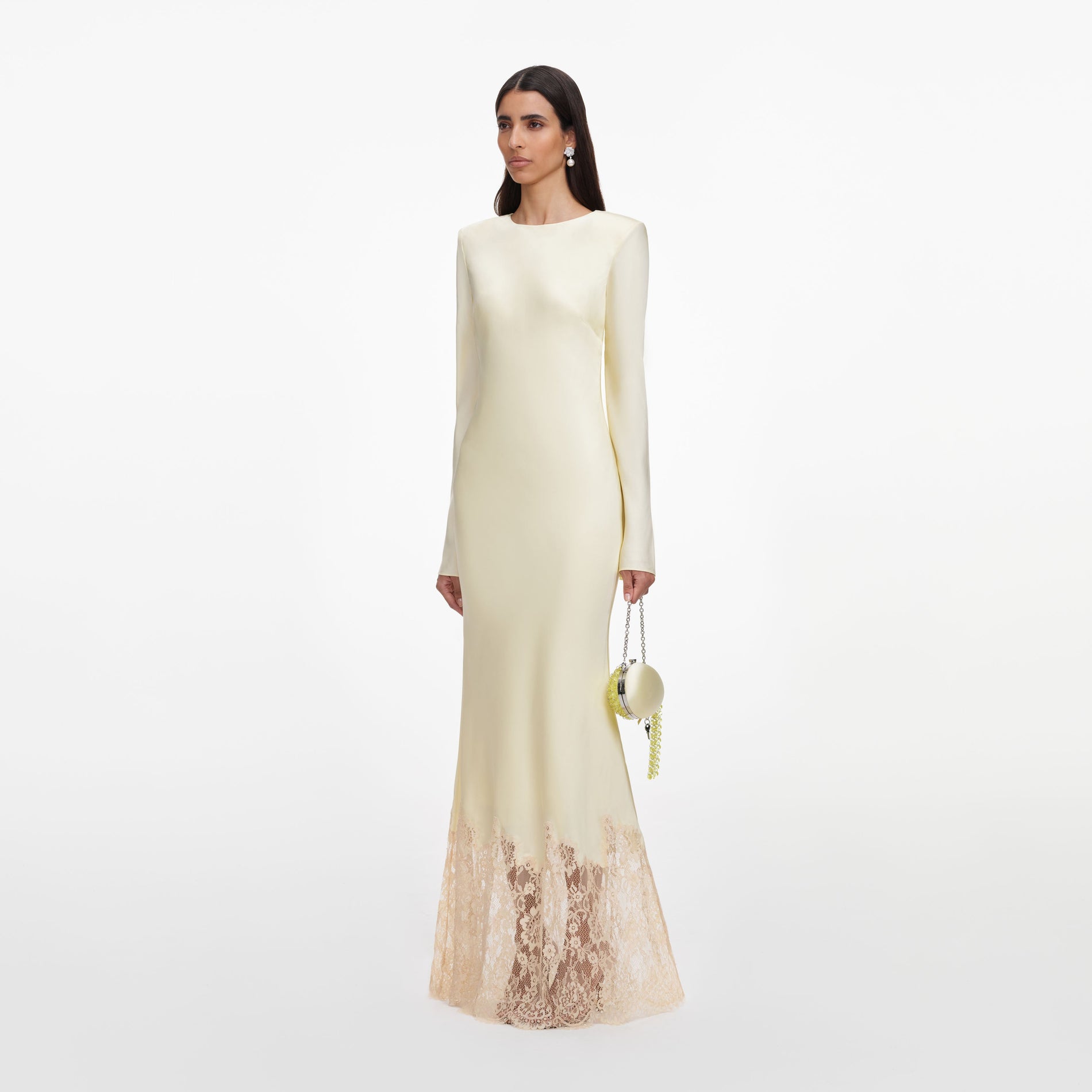 Side view of a woman wearing the Yellow Viscose Lace Maxi Dress