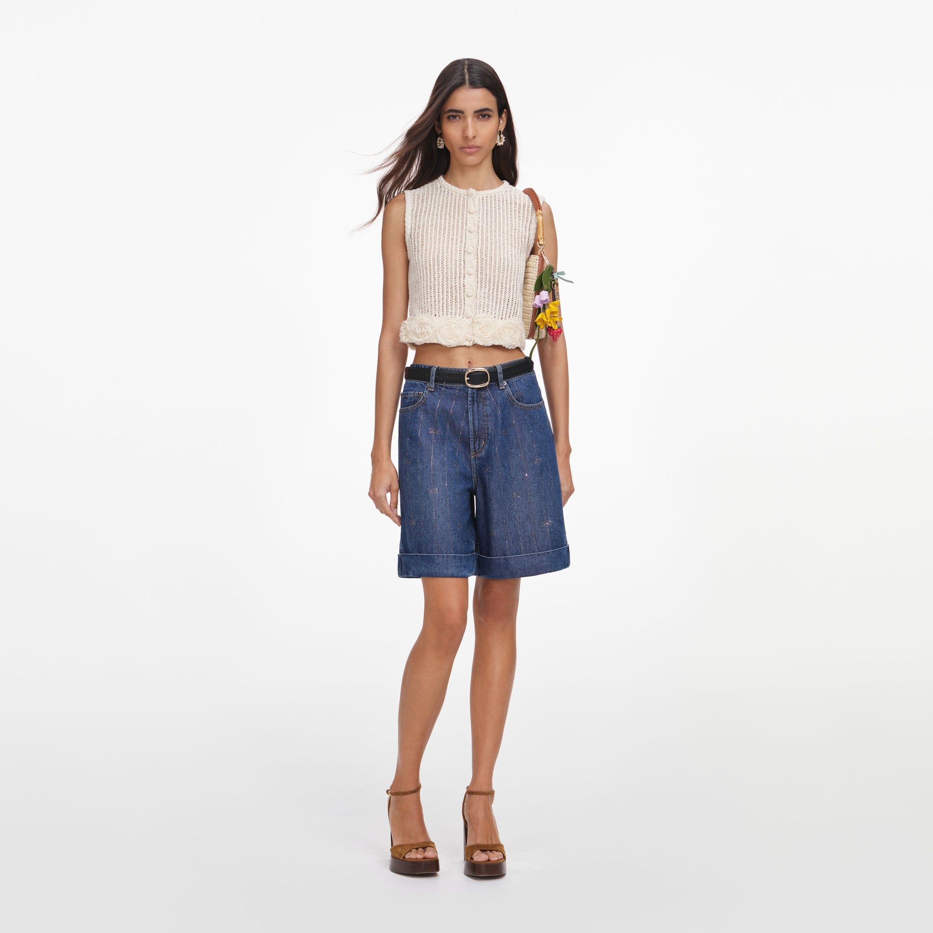 Front view of a woman wearing the Cream Crochet Flower Knit Top