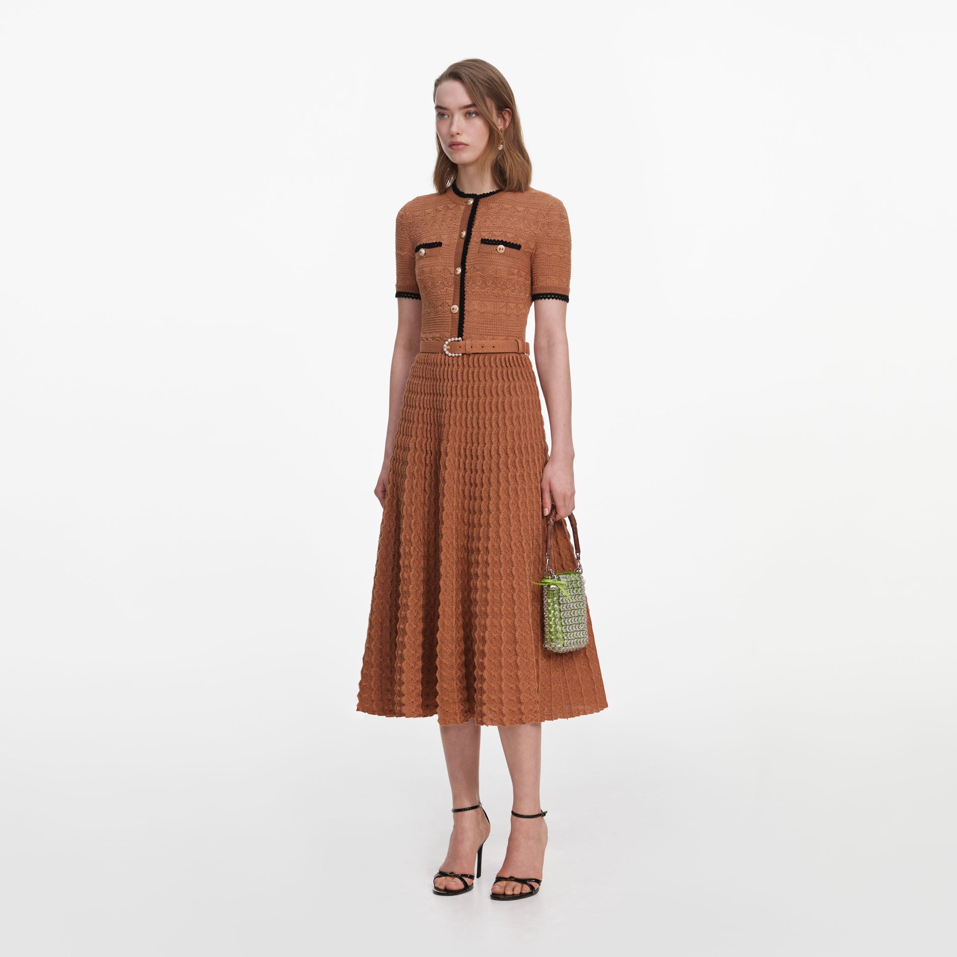Side view of a woman wearing the Brown Pointelle Knit Midi Dress