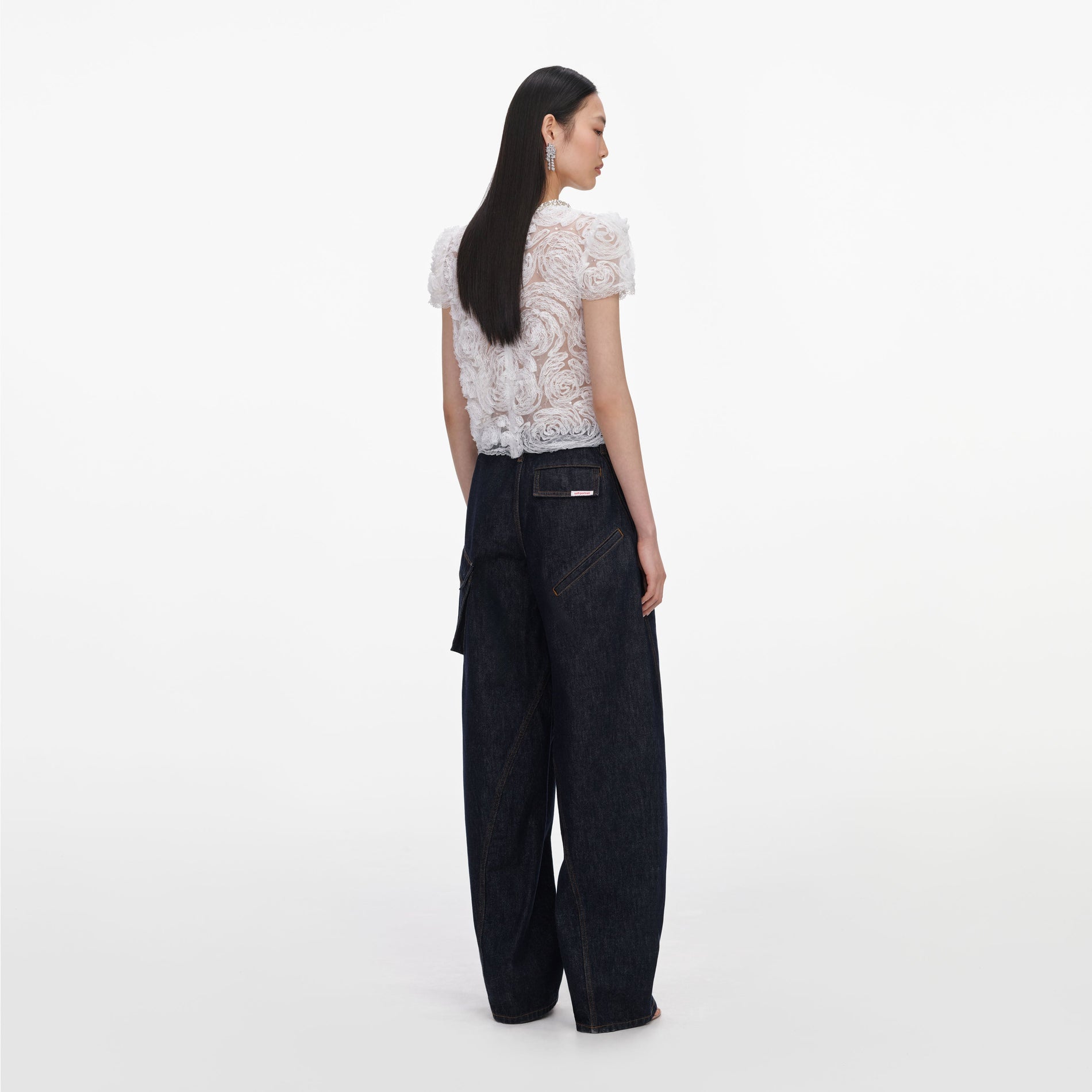 Back view of a woman wearing the White Tulle Lace Top