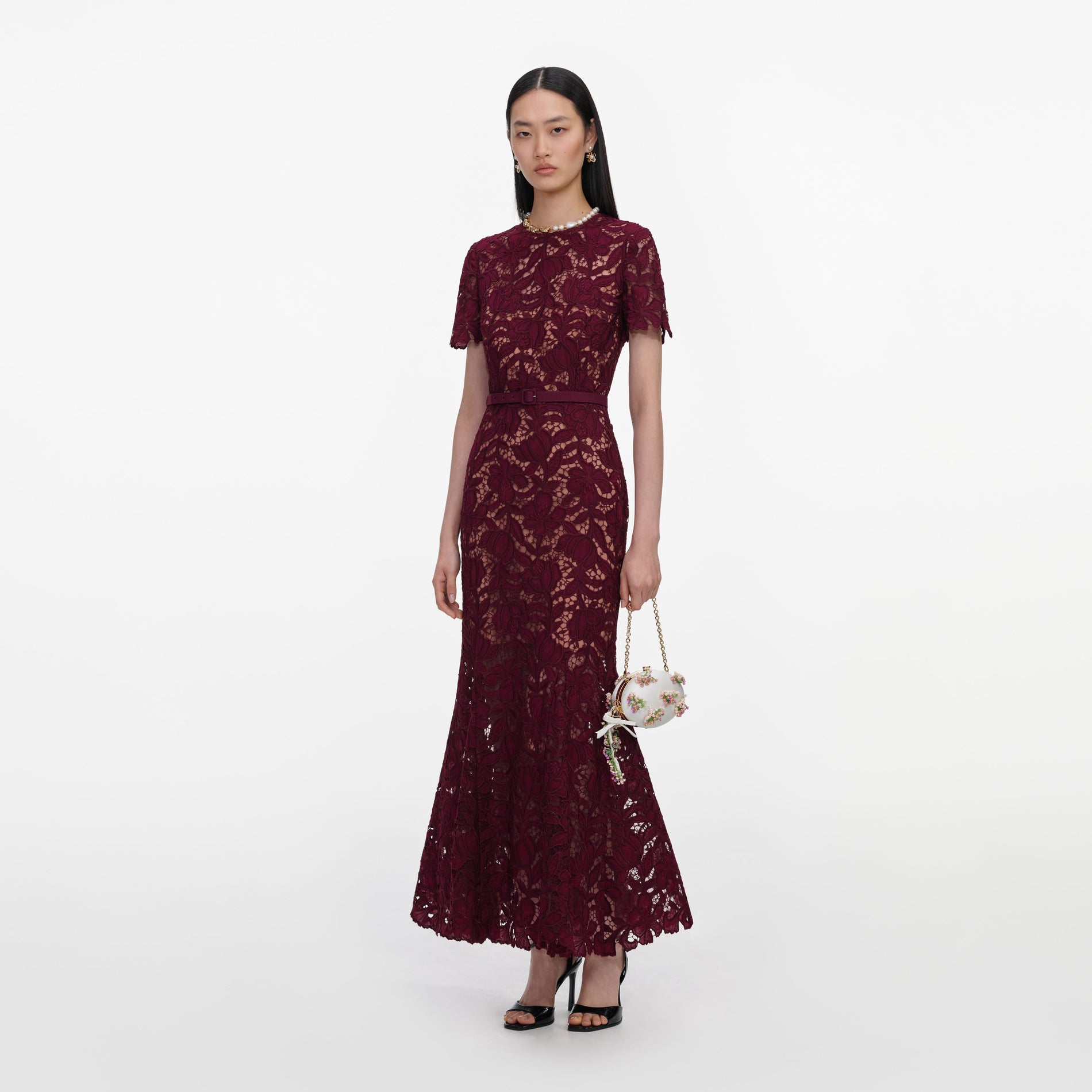 Side view of a woman wearing the Burgundy Lace Midi Dress