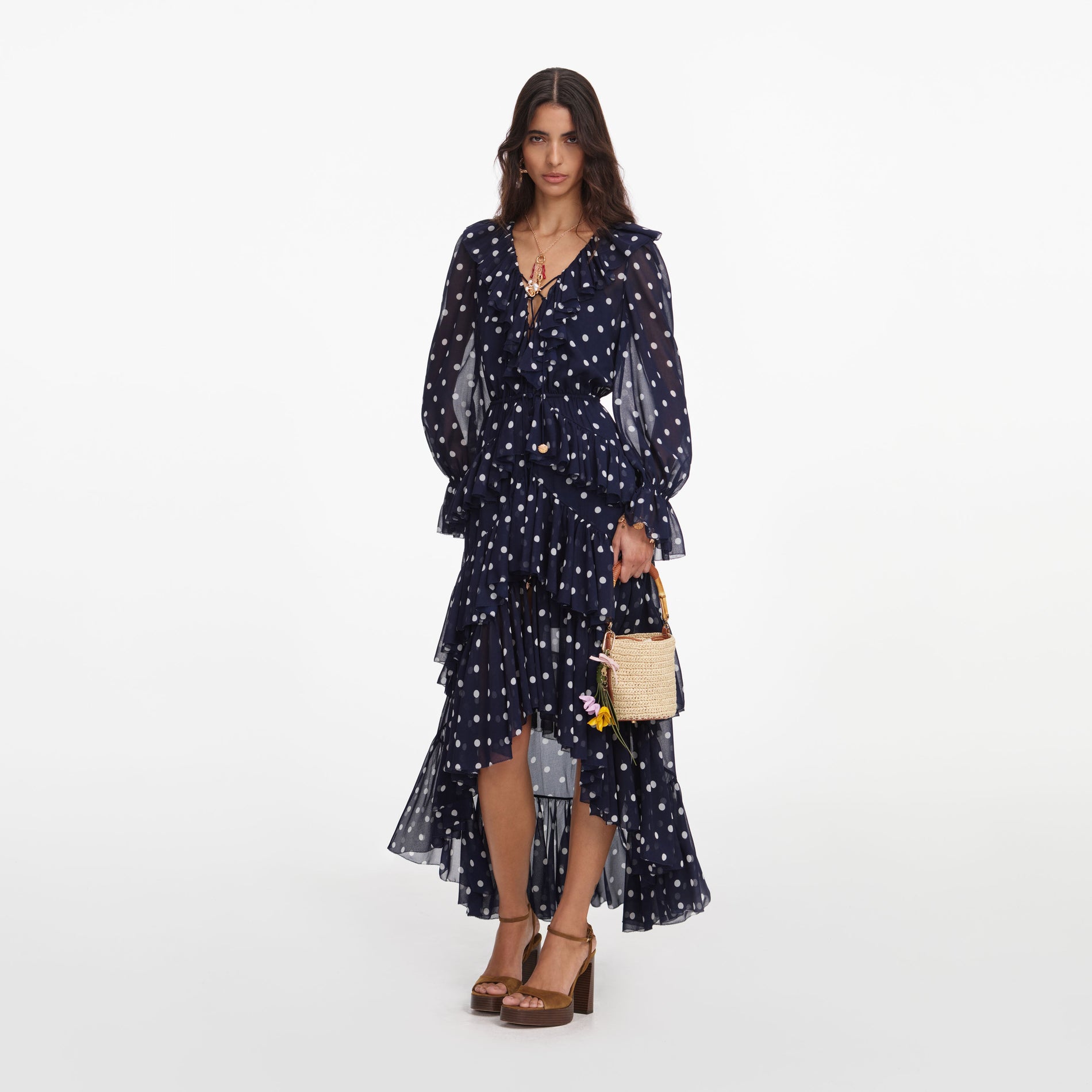 Side view of a woman wearing the Polka Dot Georgette Ruffle Maxi Dress