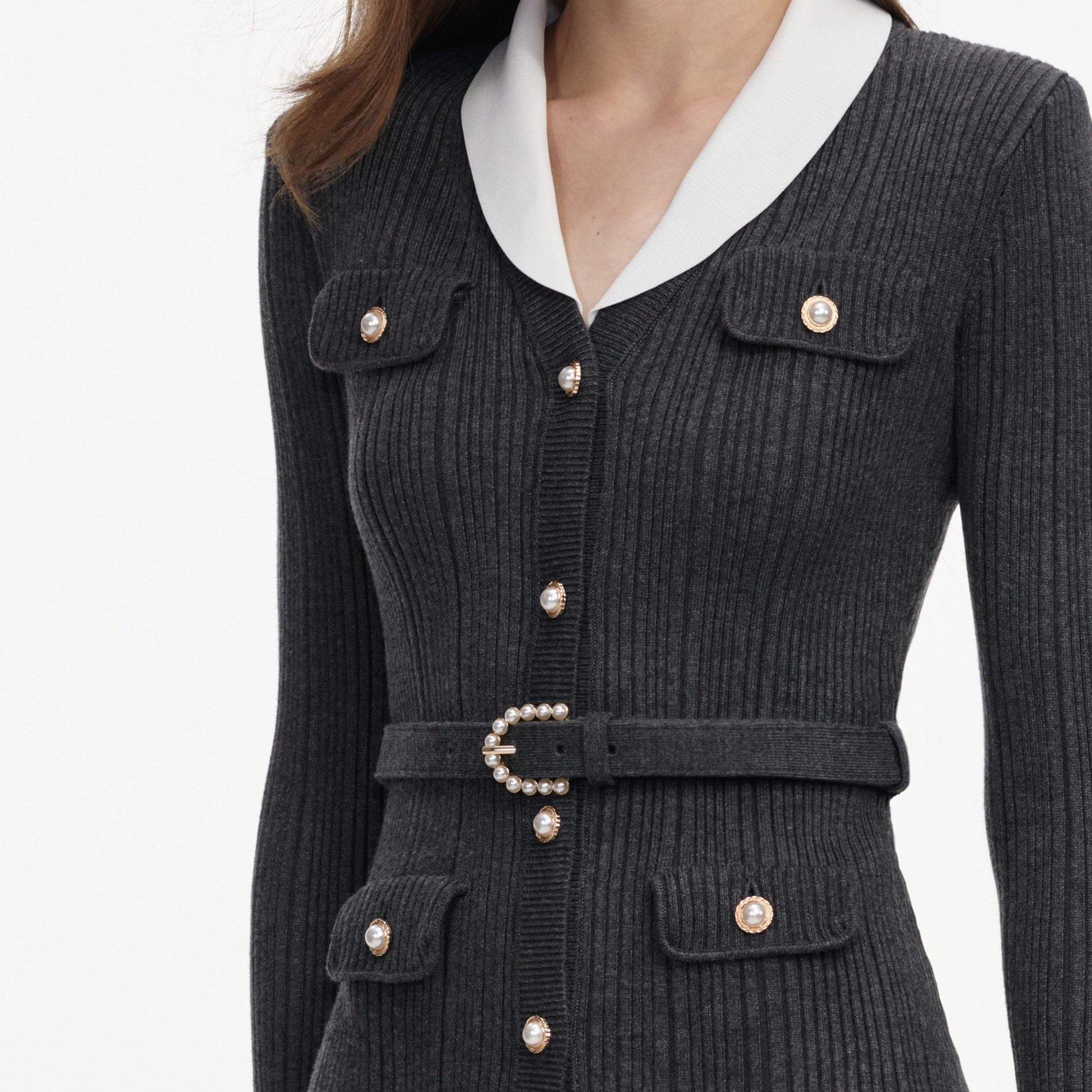 A close up of a woman wearing the Grey Ribbed Knit Cardigan