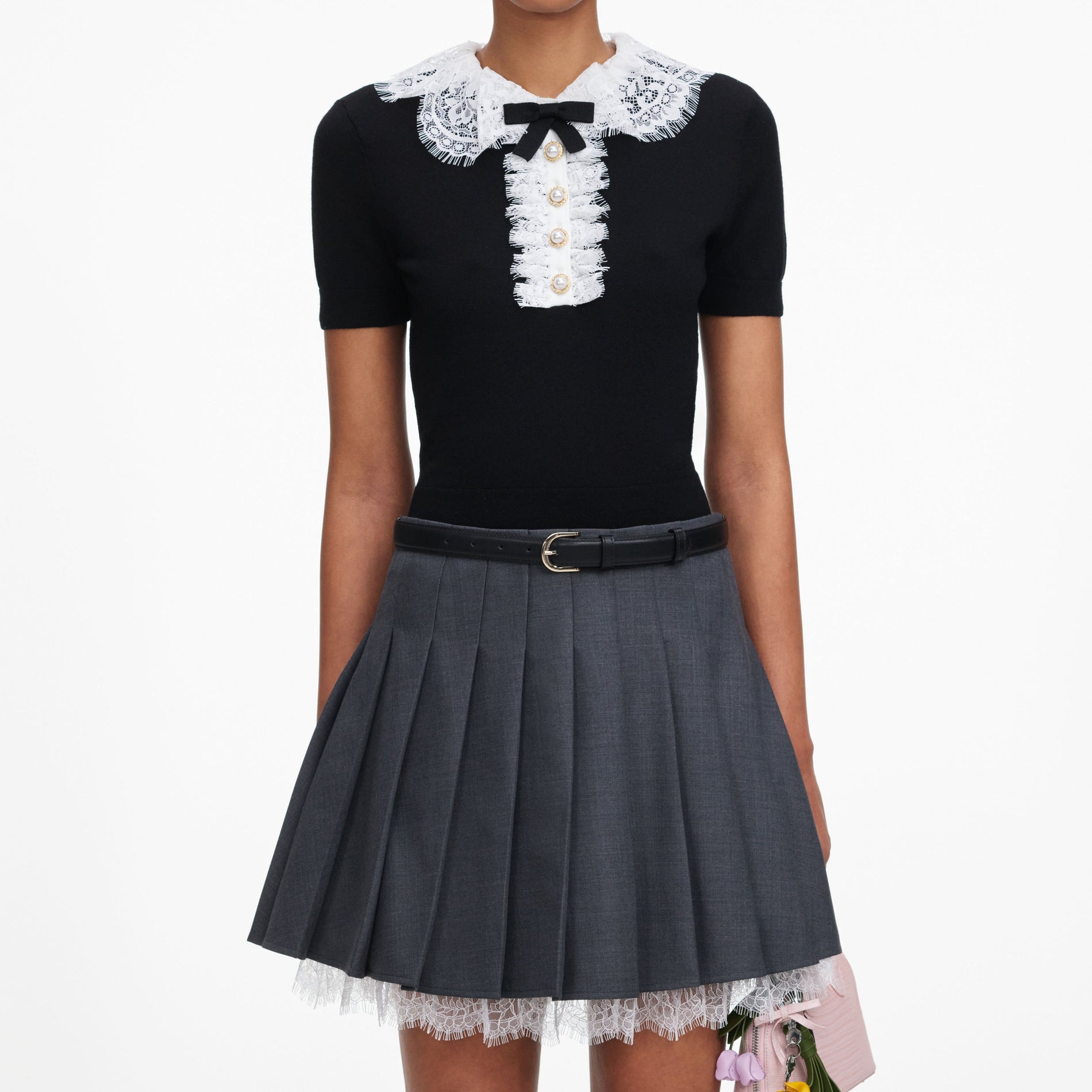 A close up of a woman wearing the Black Knit Lace Collar Top