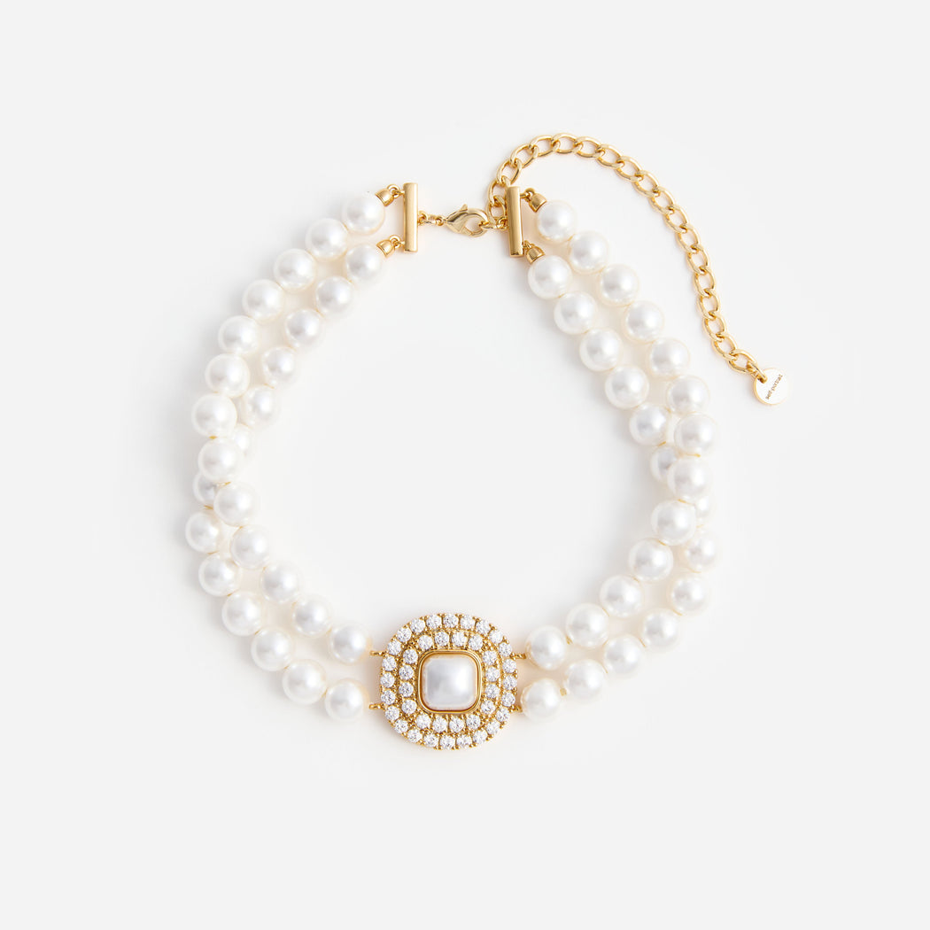 Double strand pearl necklace with a square pearl and rhinestone pendant
