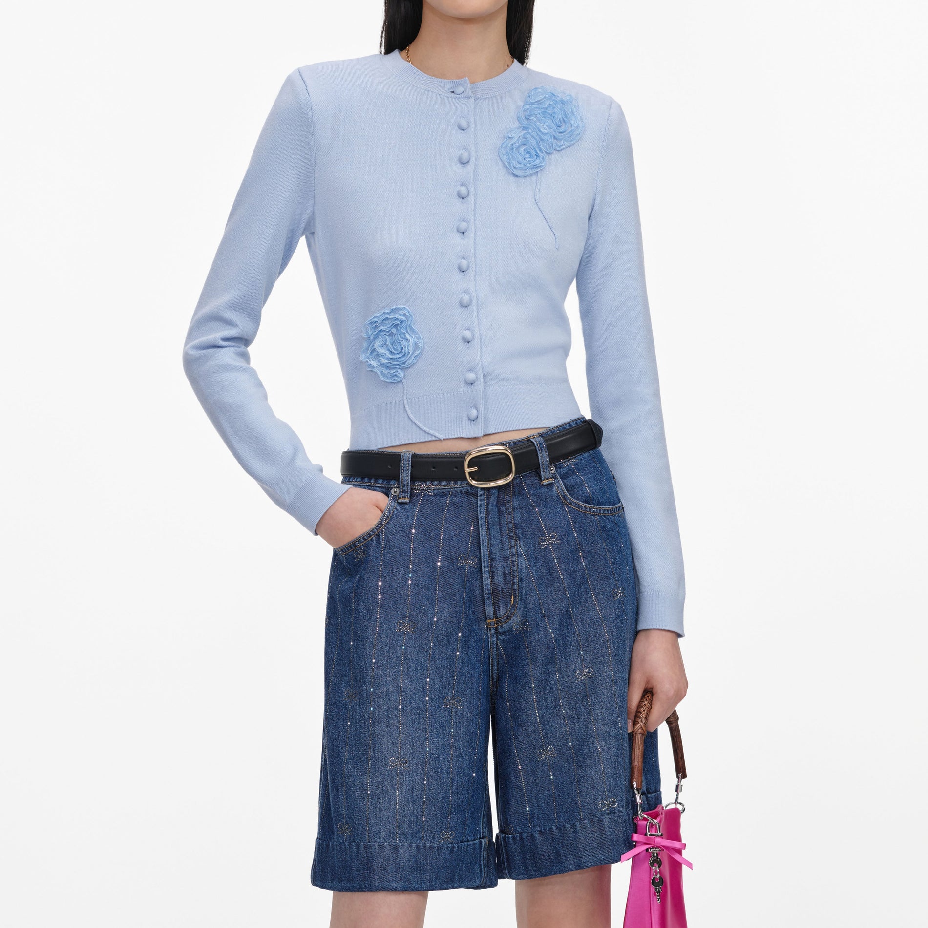 A close up of a woman wearing the Rhinestone Stripe Denim Shorts