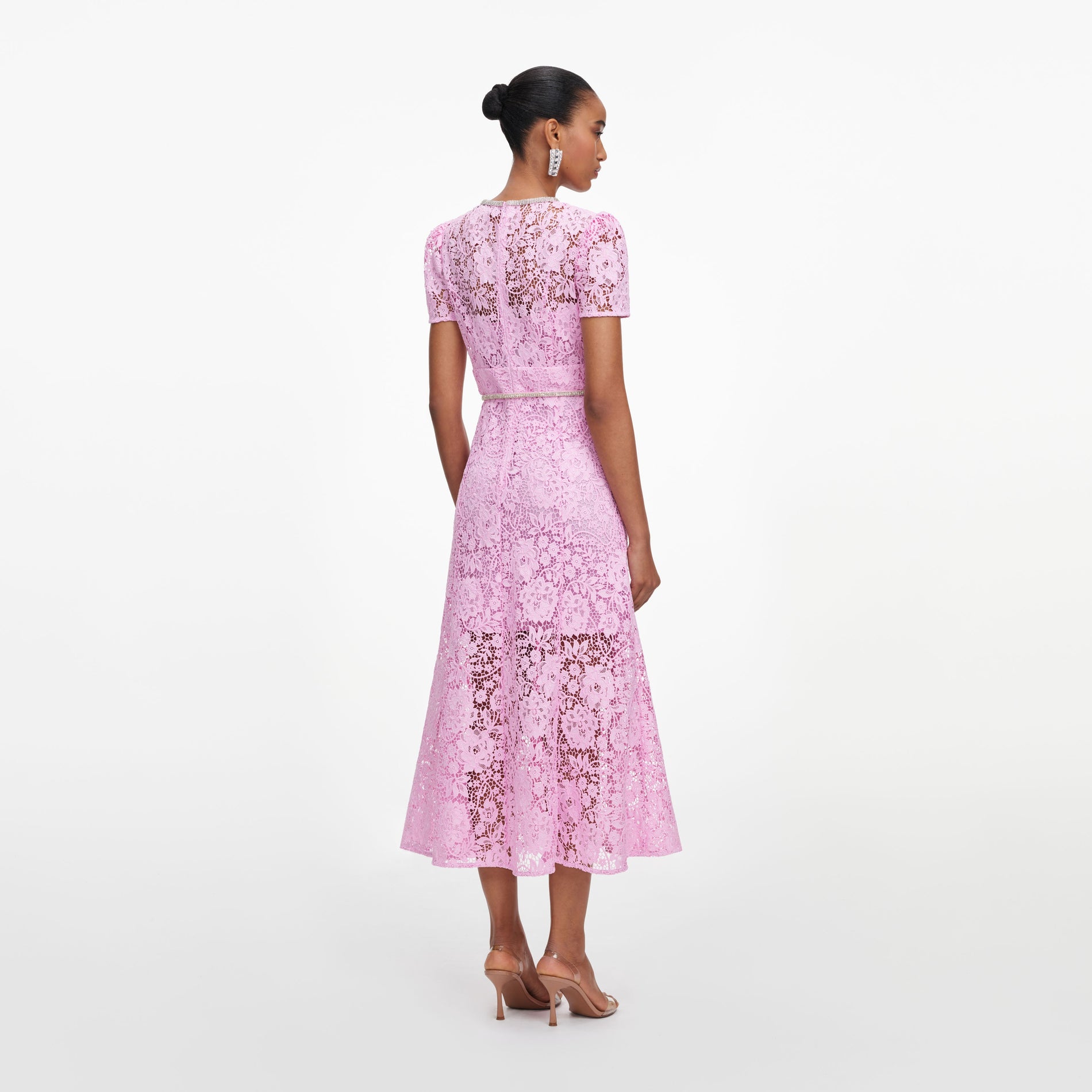 Back view of a woman wearing the Pink Cord Lace Midi Dress