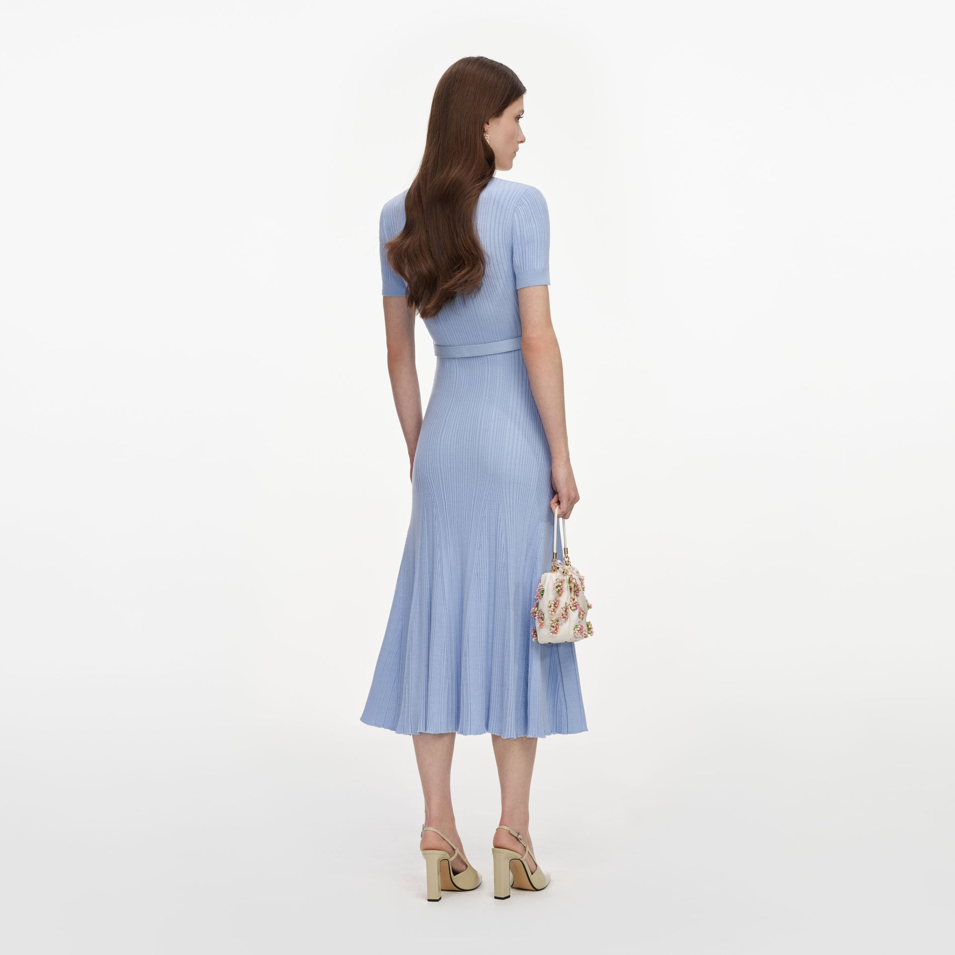Back view of a woman wearing the Blue Ribbed Knit Midi Dress