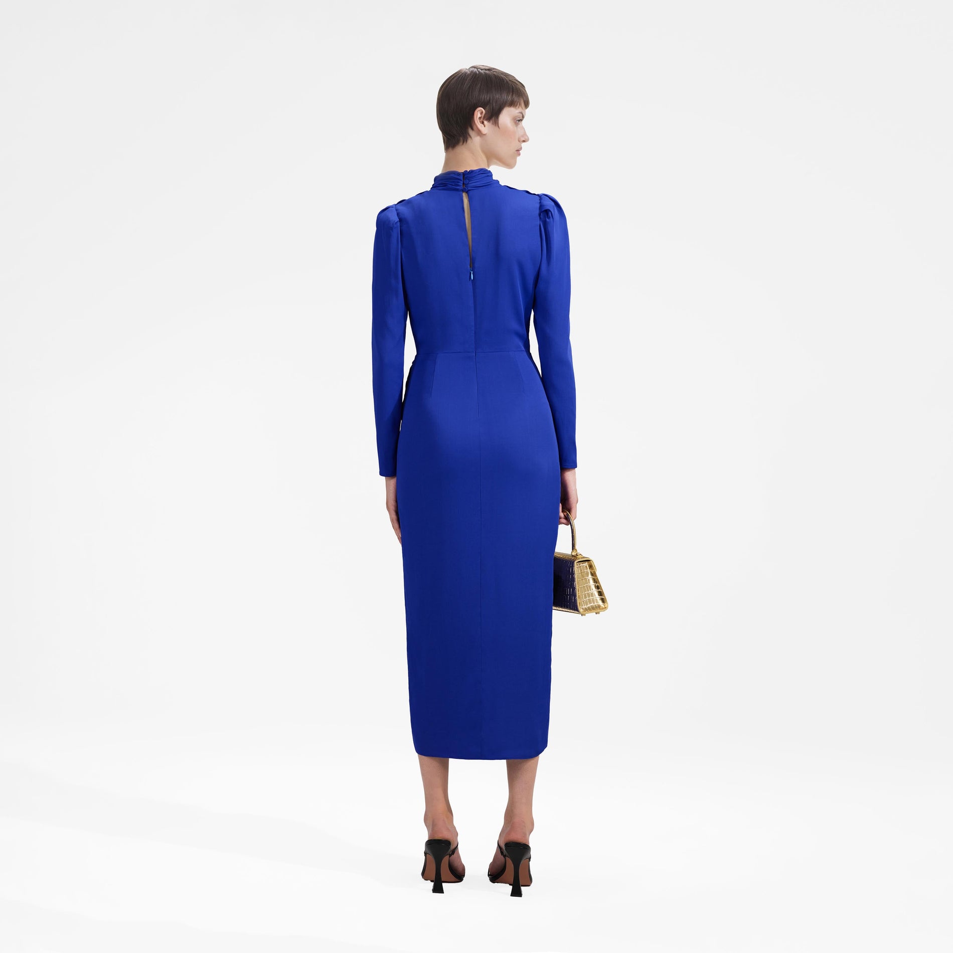 Back view of a woman wearing the Blue Stretch Crepe Twisted Collar Midi Dress