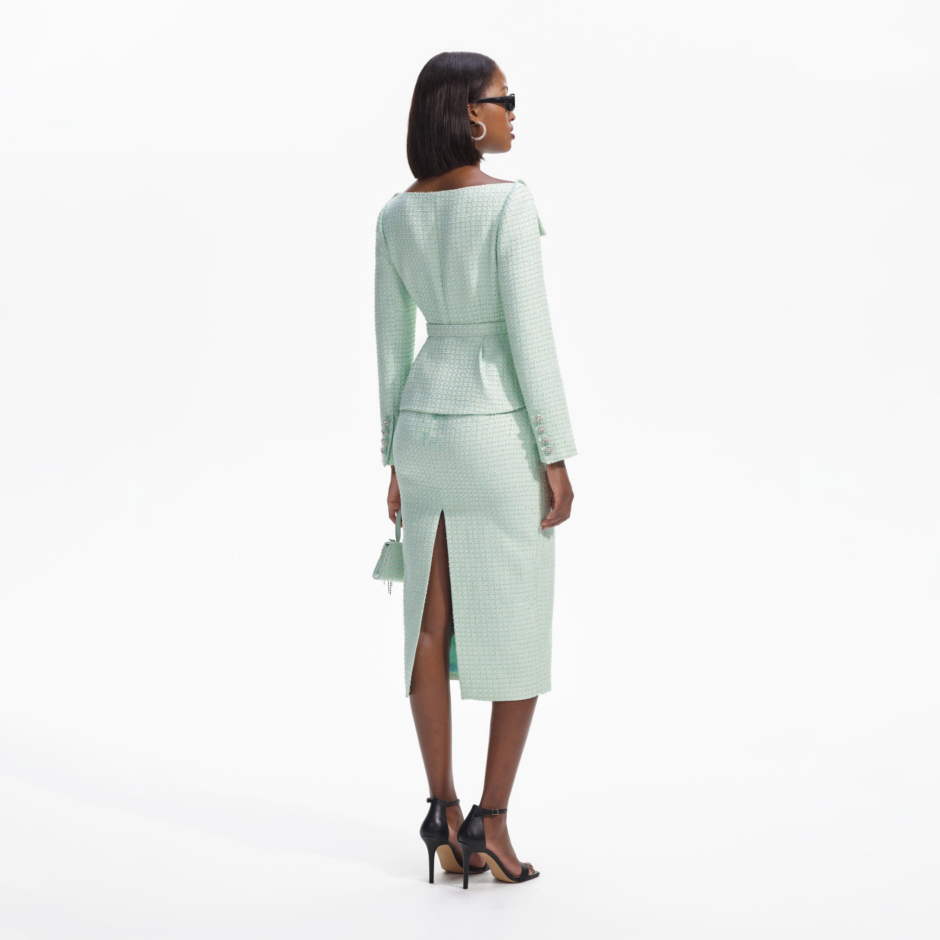 Back view of a woman wearing the Mint Boucle Tailored Midi Dress