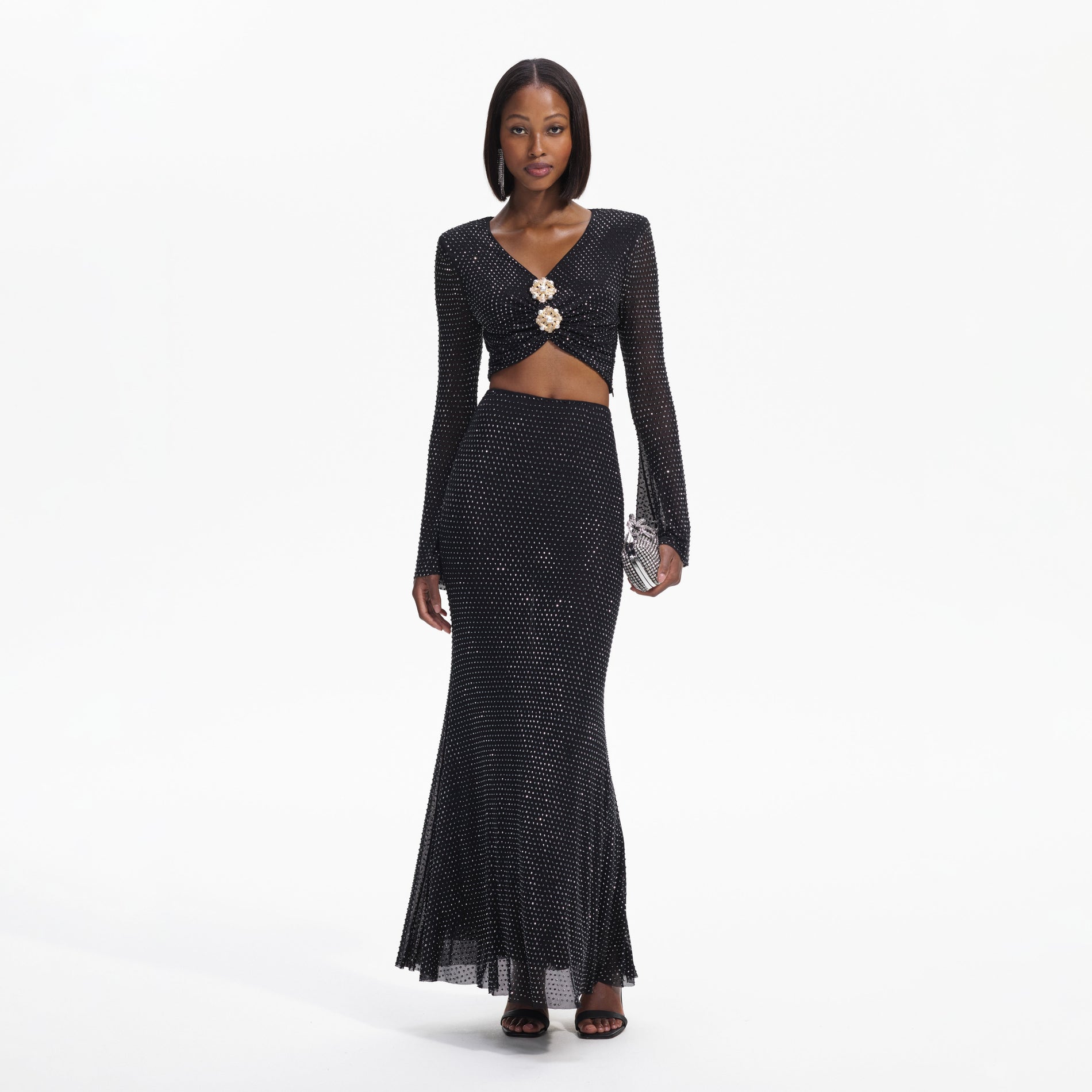 Front view of a woman wearing the Black Rhinestone  Maxi Skirt