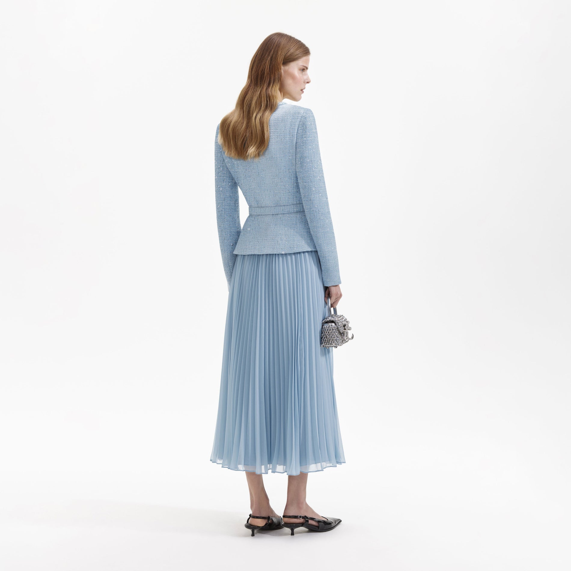 Back view of a woman wearing the Blue Boucle Tailored Midi Dress