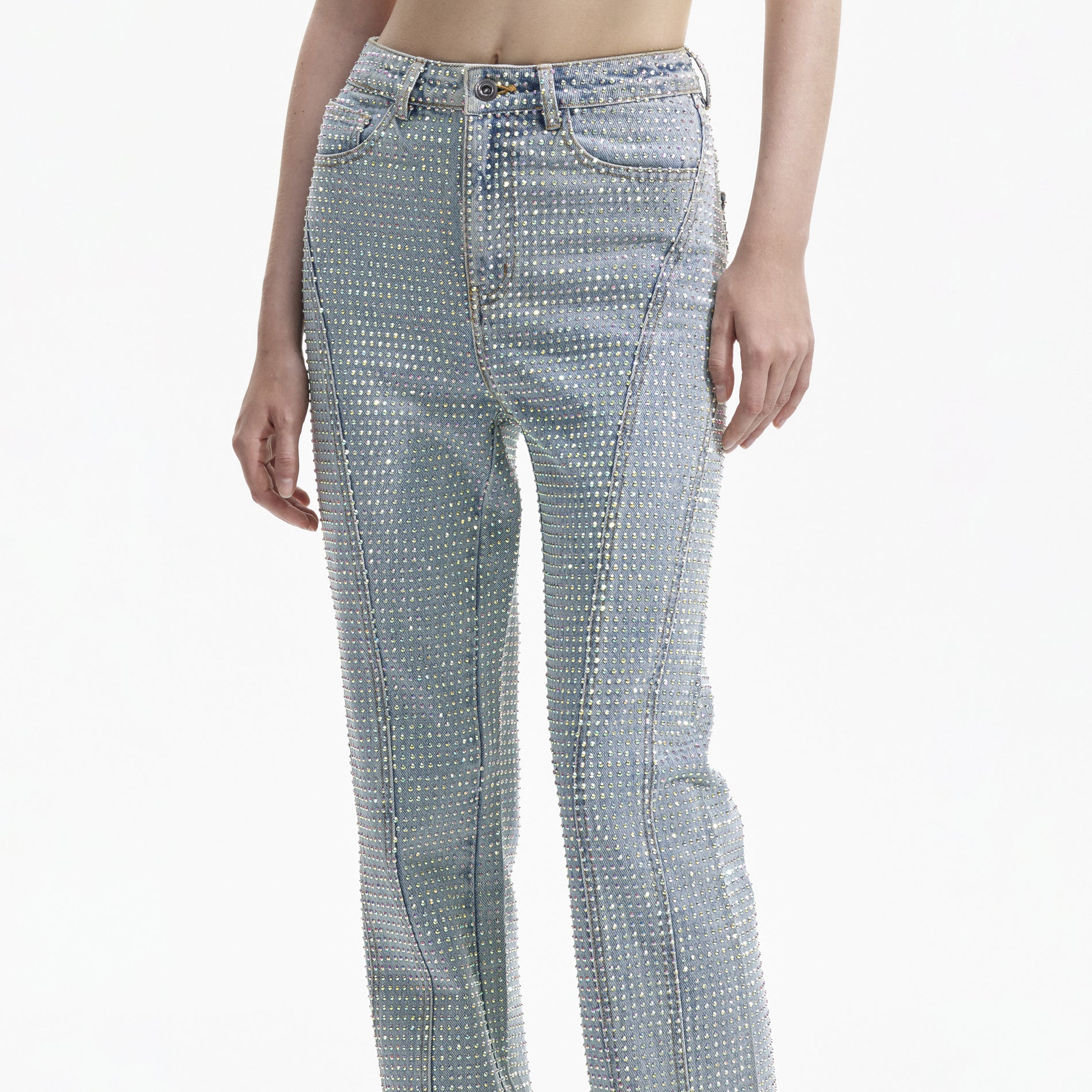 A close up of a woman wearing the Blue Rhinestone Denim Jeans