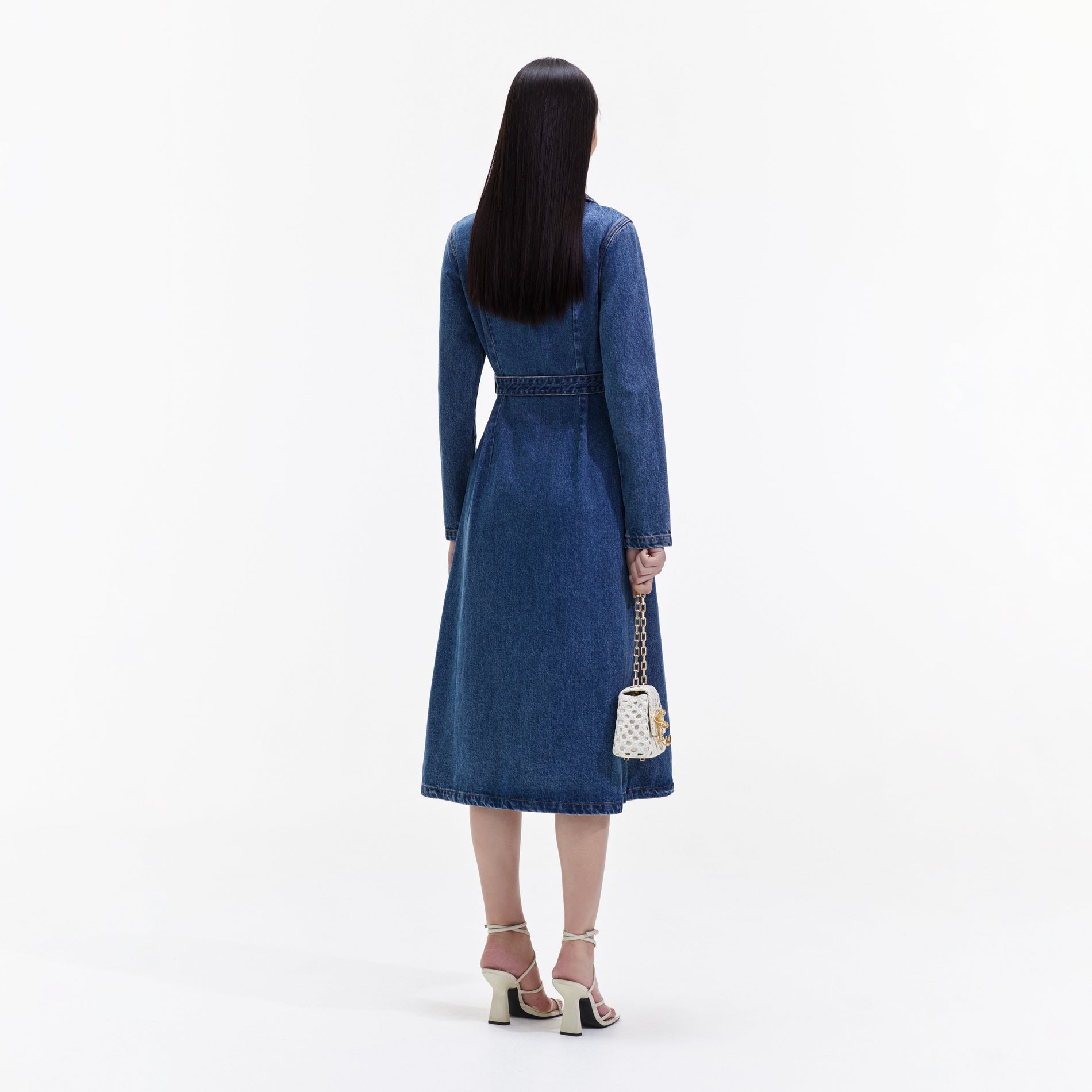 Back view of a woman wearing the Blue Denim Belted Midi Dress