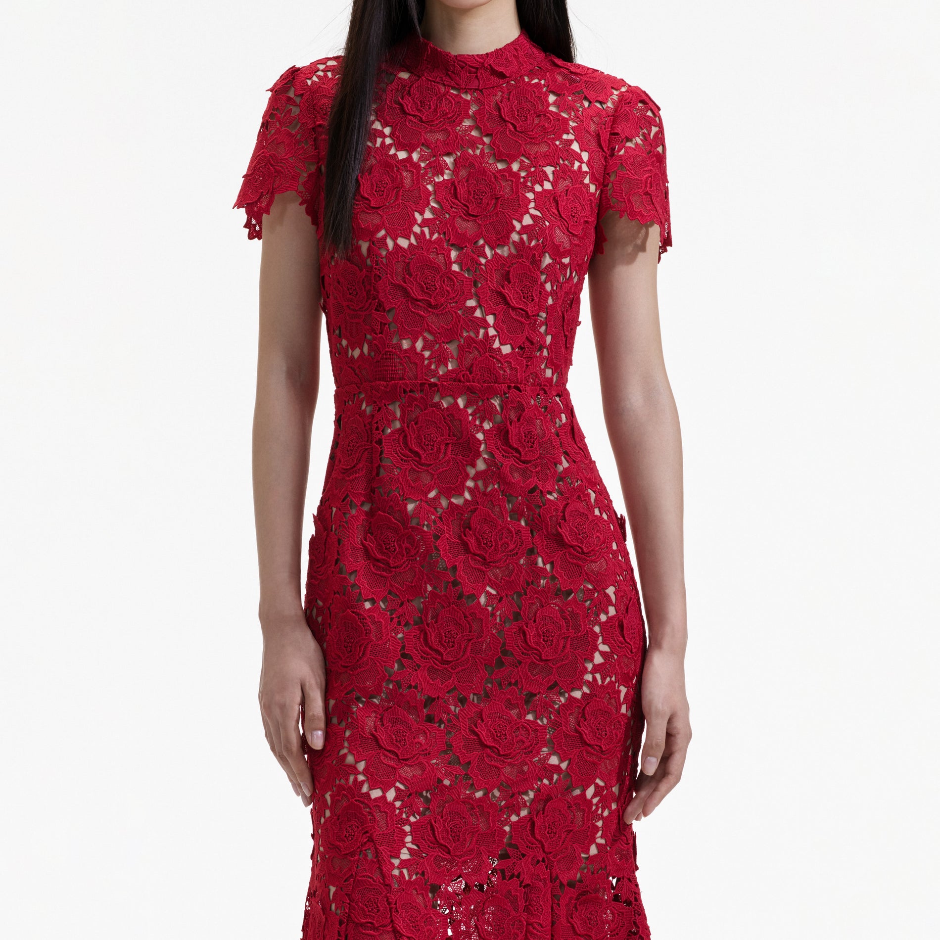 A close up of a woman wearing the Red Flower Lace Midi Dress