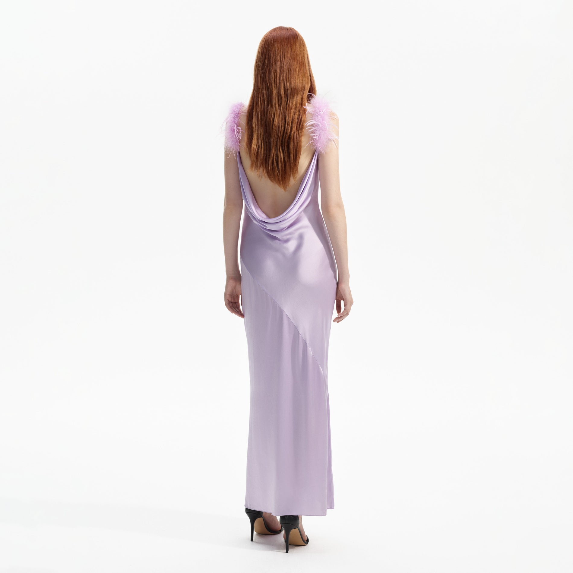 Back view of a woman wearing the Lilac Silk Feather Maxi Dress