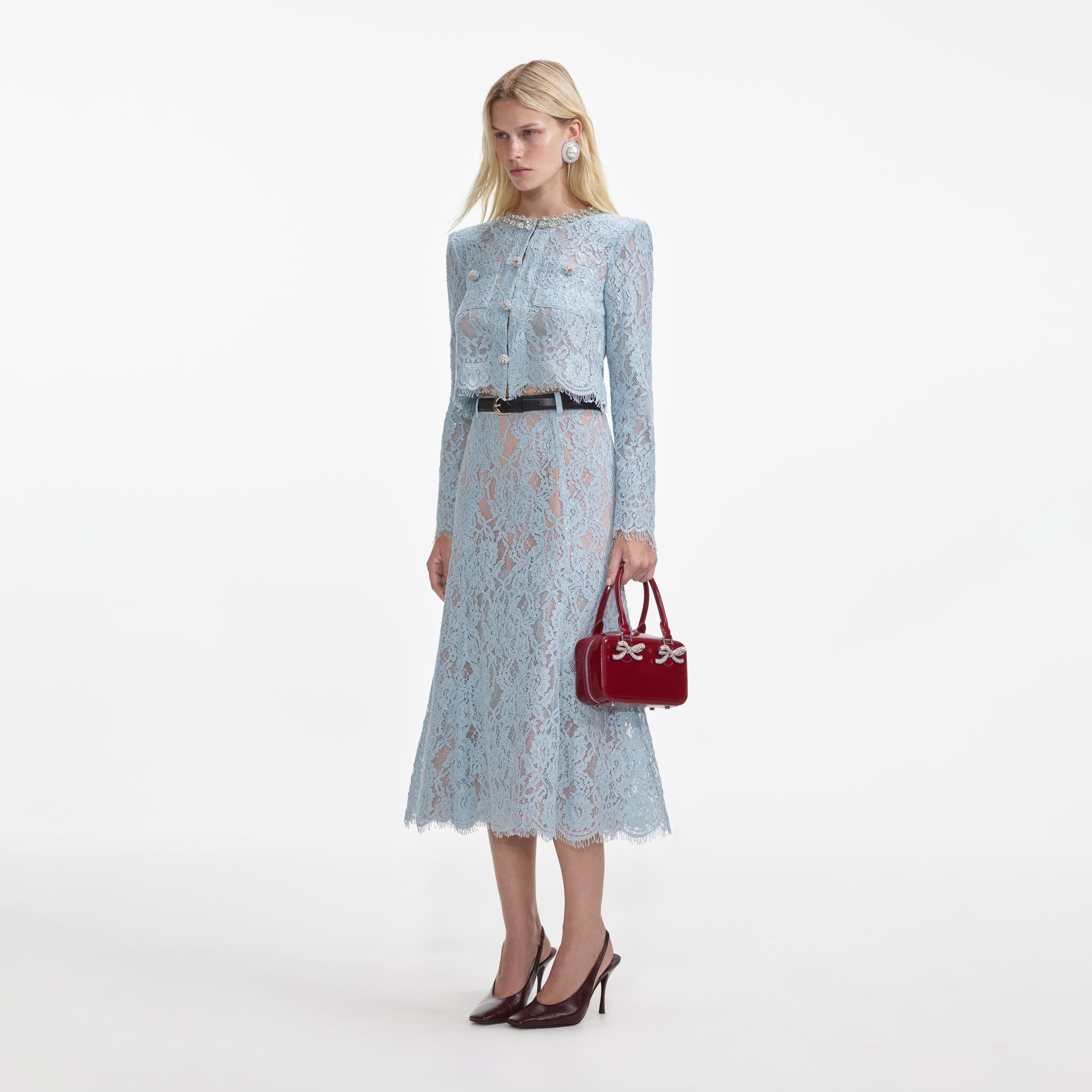 Side view of a woman wearing the Blue Lace Flared Midi Skirt
