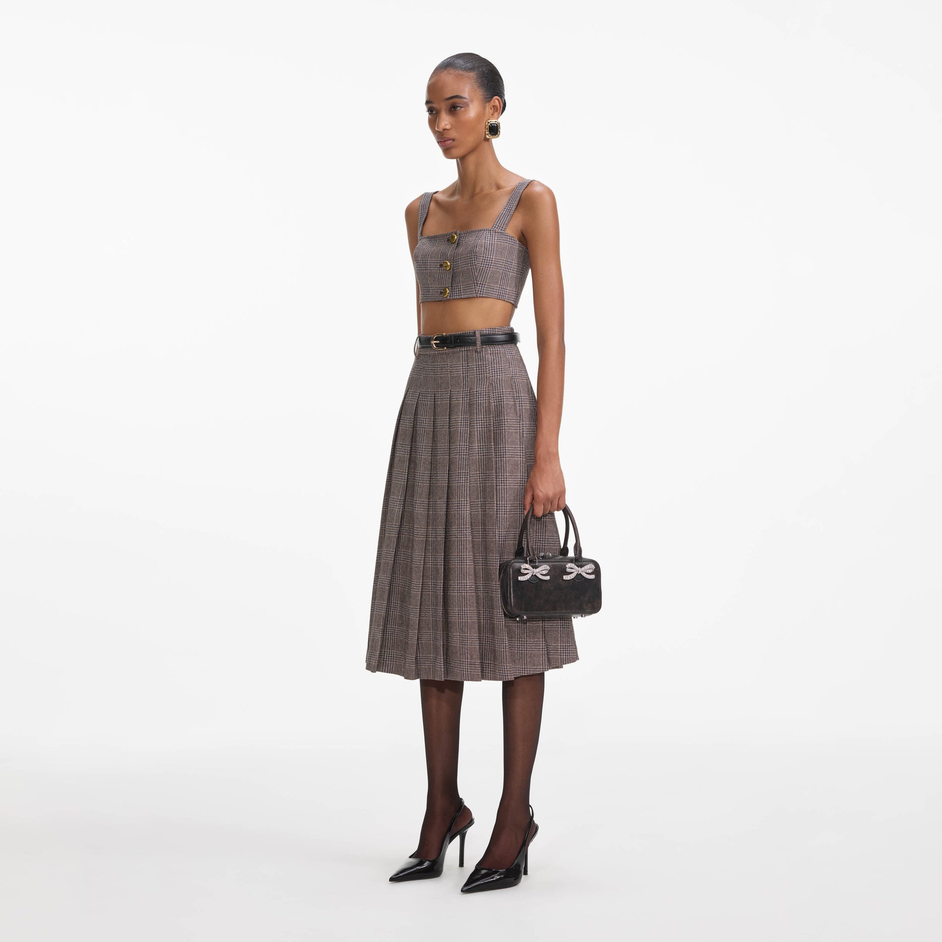 Side view of a woman wearing the Brown Check Crop Top