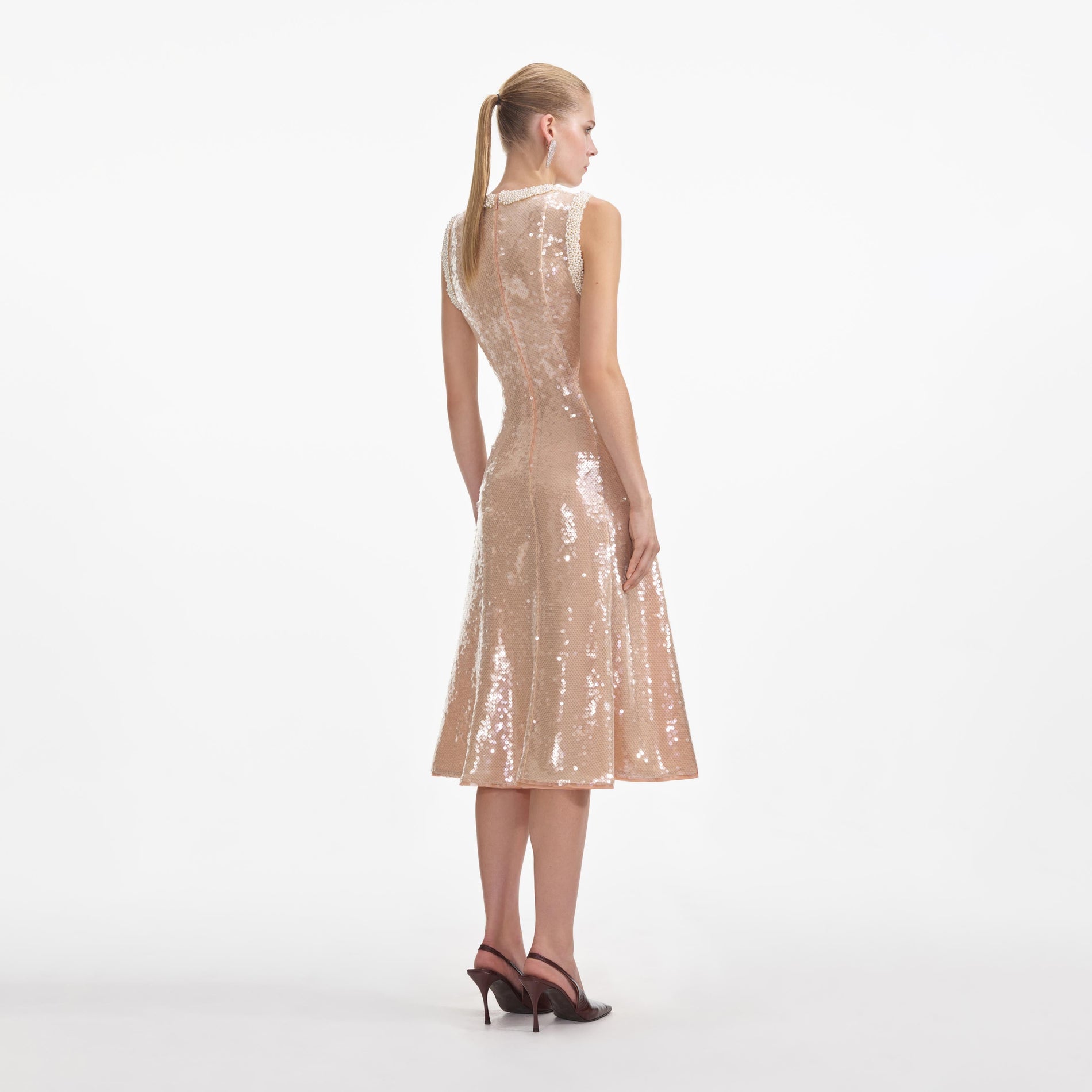 Back view of a woman wearing the Sequin Pearl Trim Midi Dress