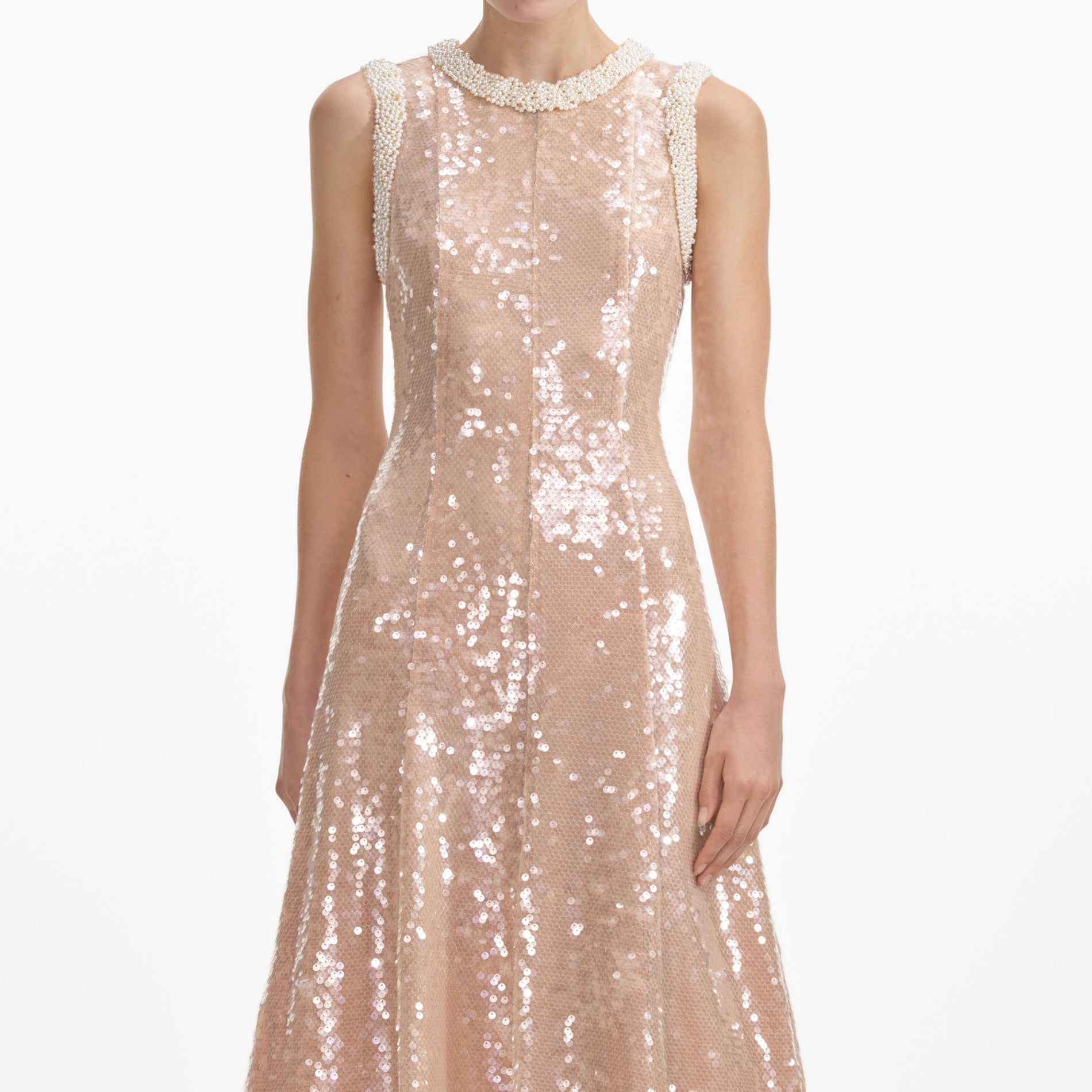 A close up of a woman wearing the Sequin Pearl Trim Midi Dress
