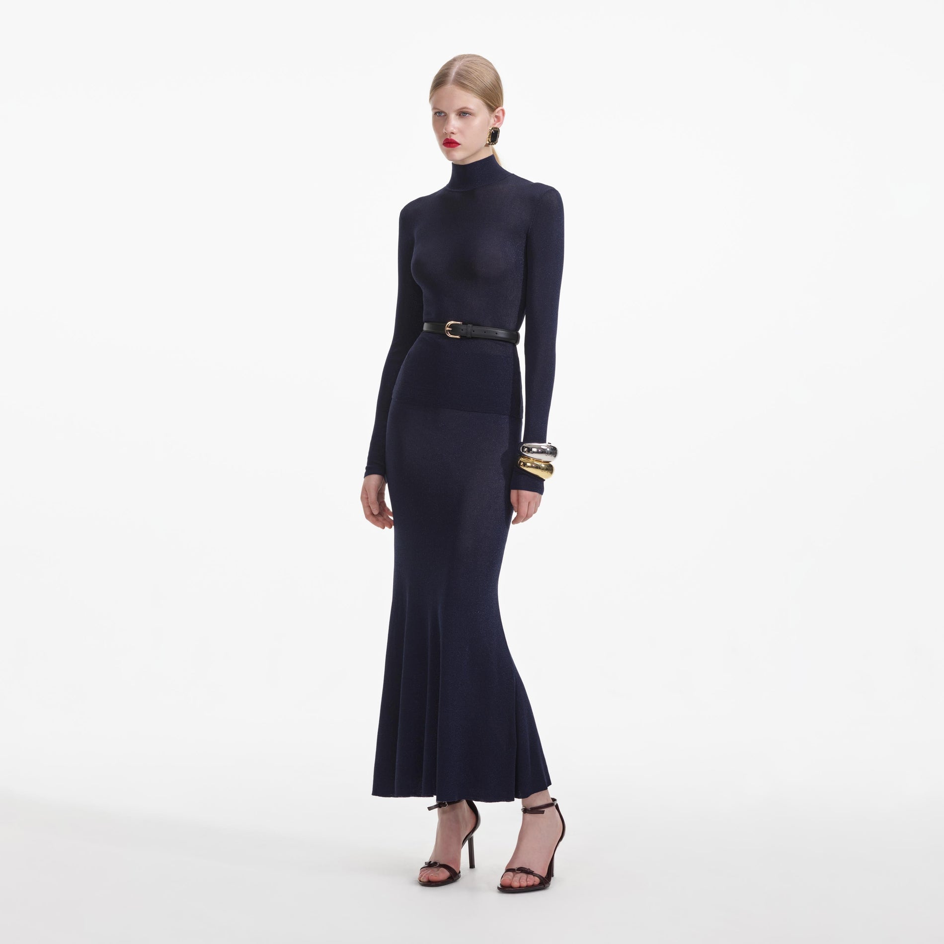 Side view of a woman wearing the Navy Viscose Knit Top