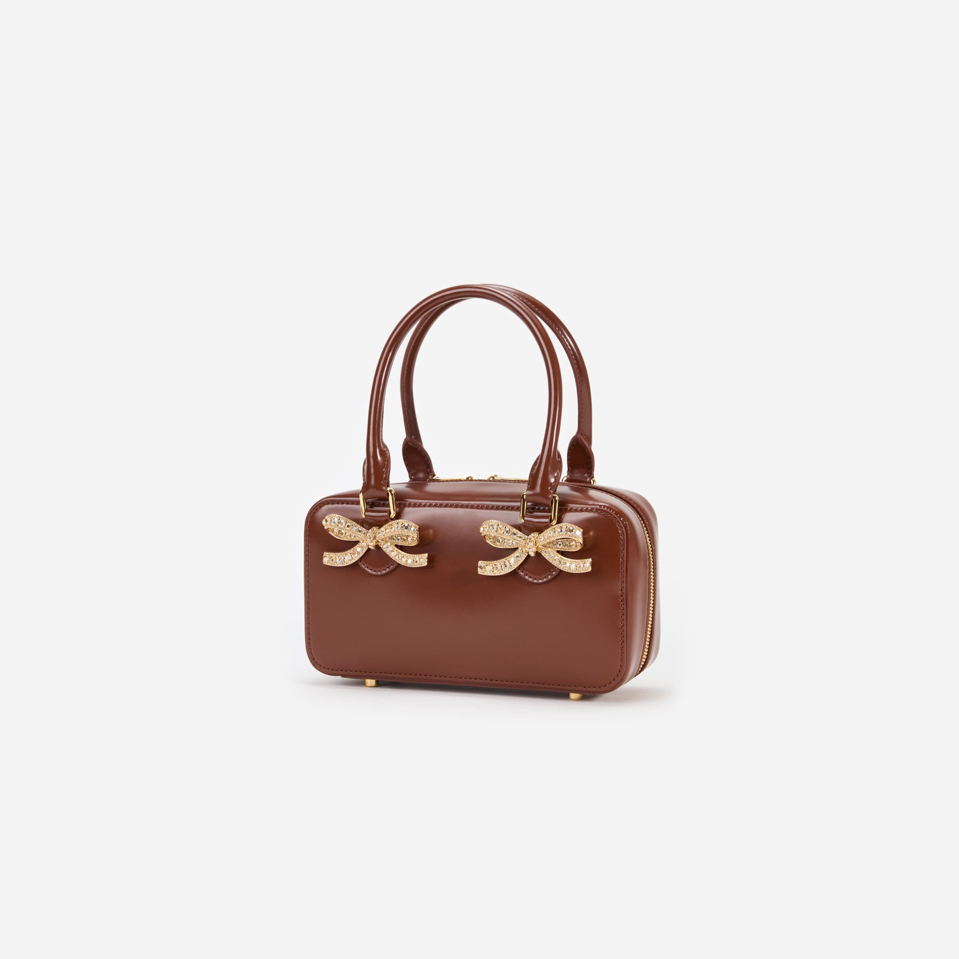 Side view of a woman wearing the Brown Leather Mini Tote Bag