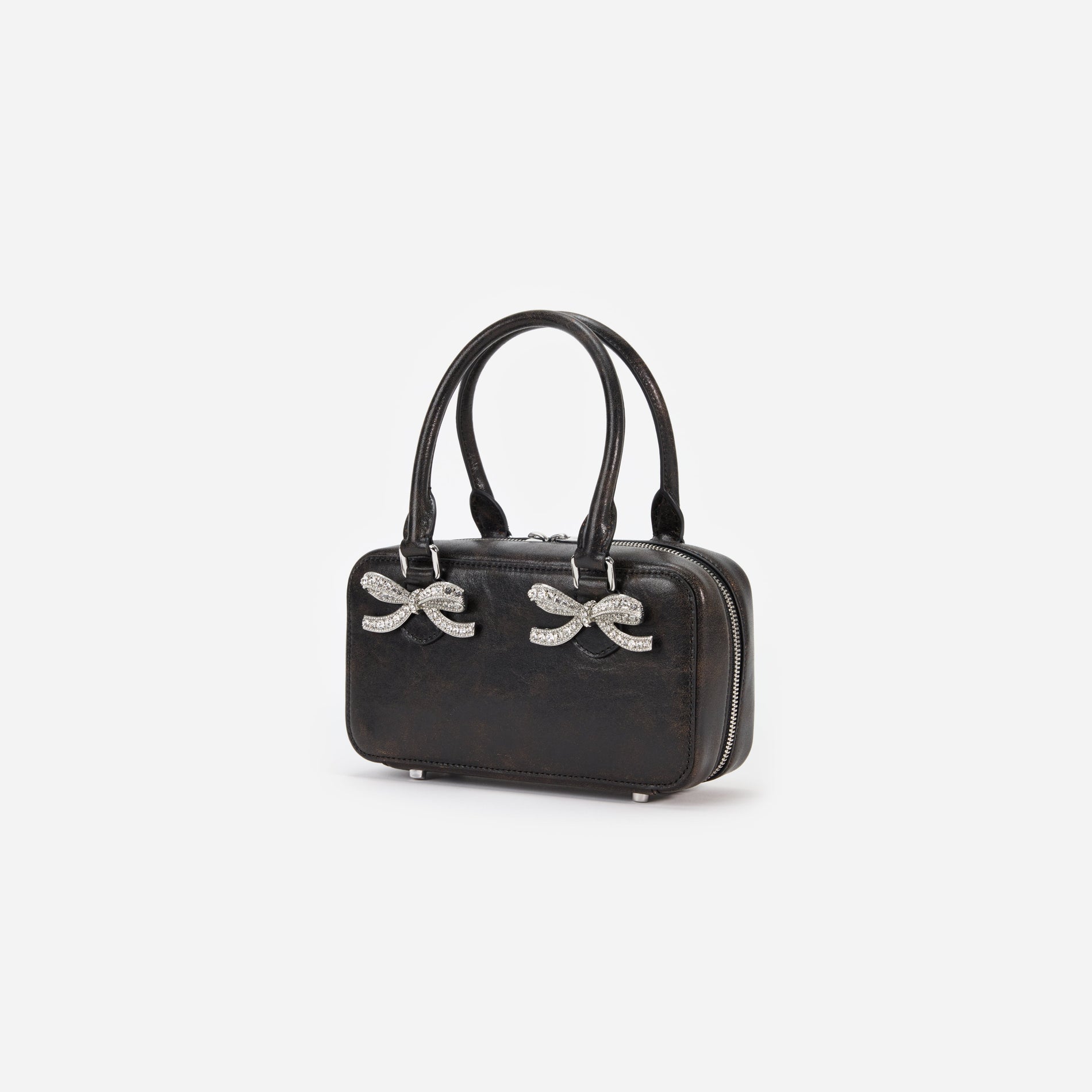 Side view of a woman wearing the Black Distressed Leather Mini Tote Bag