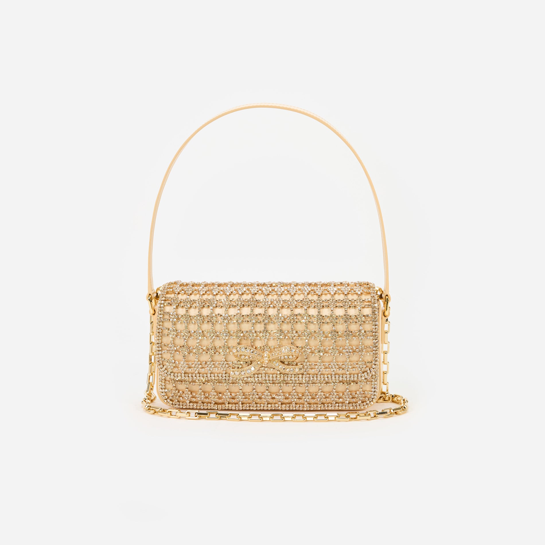 A close up of a woman wearing the Gold Crystal Baguette Bag
