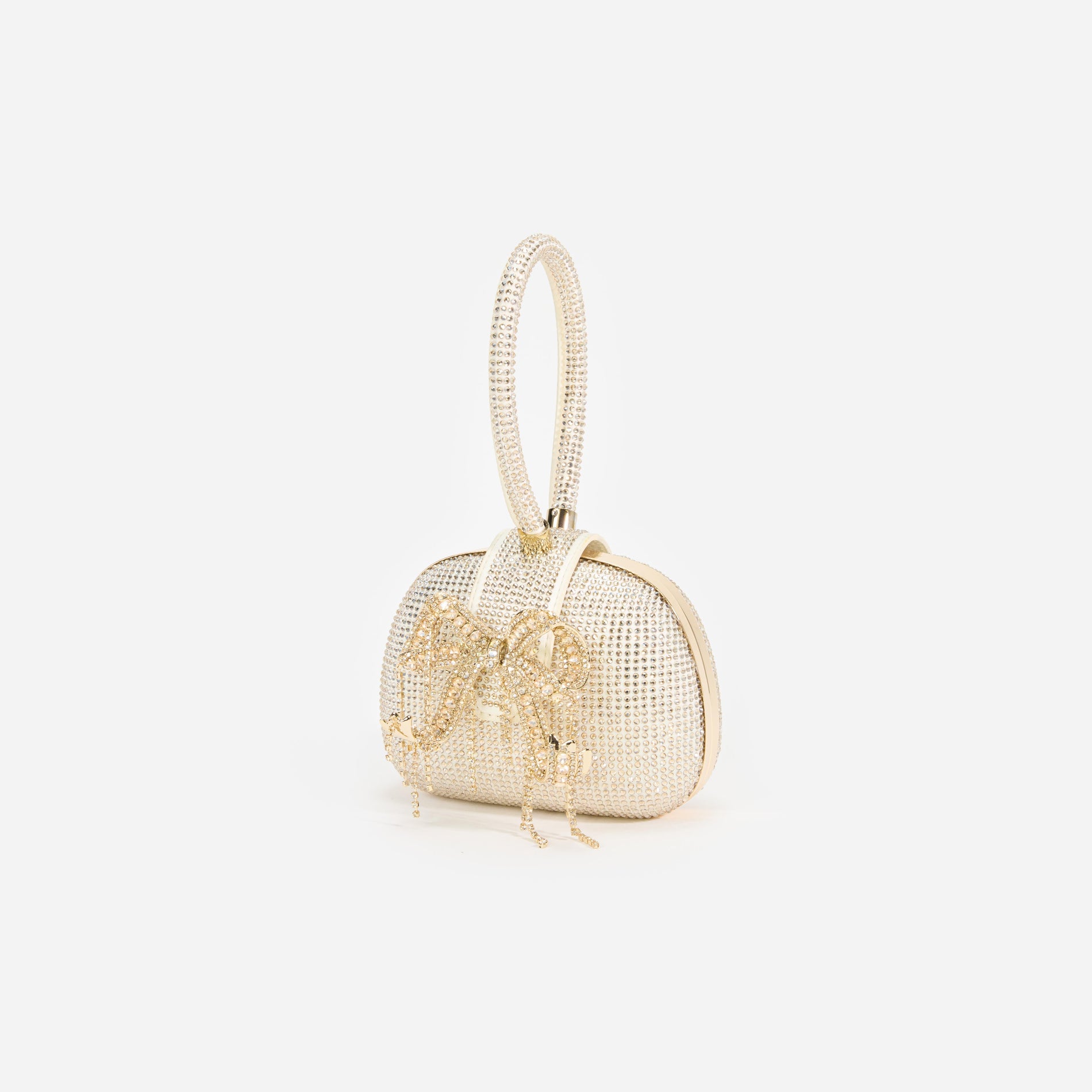 Side view of a woman wearing the Champagne Rhinestone Top Handle Clutch Bag