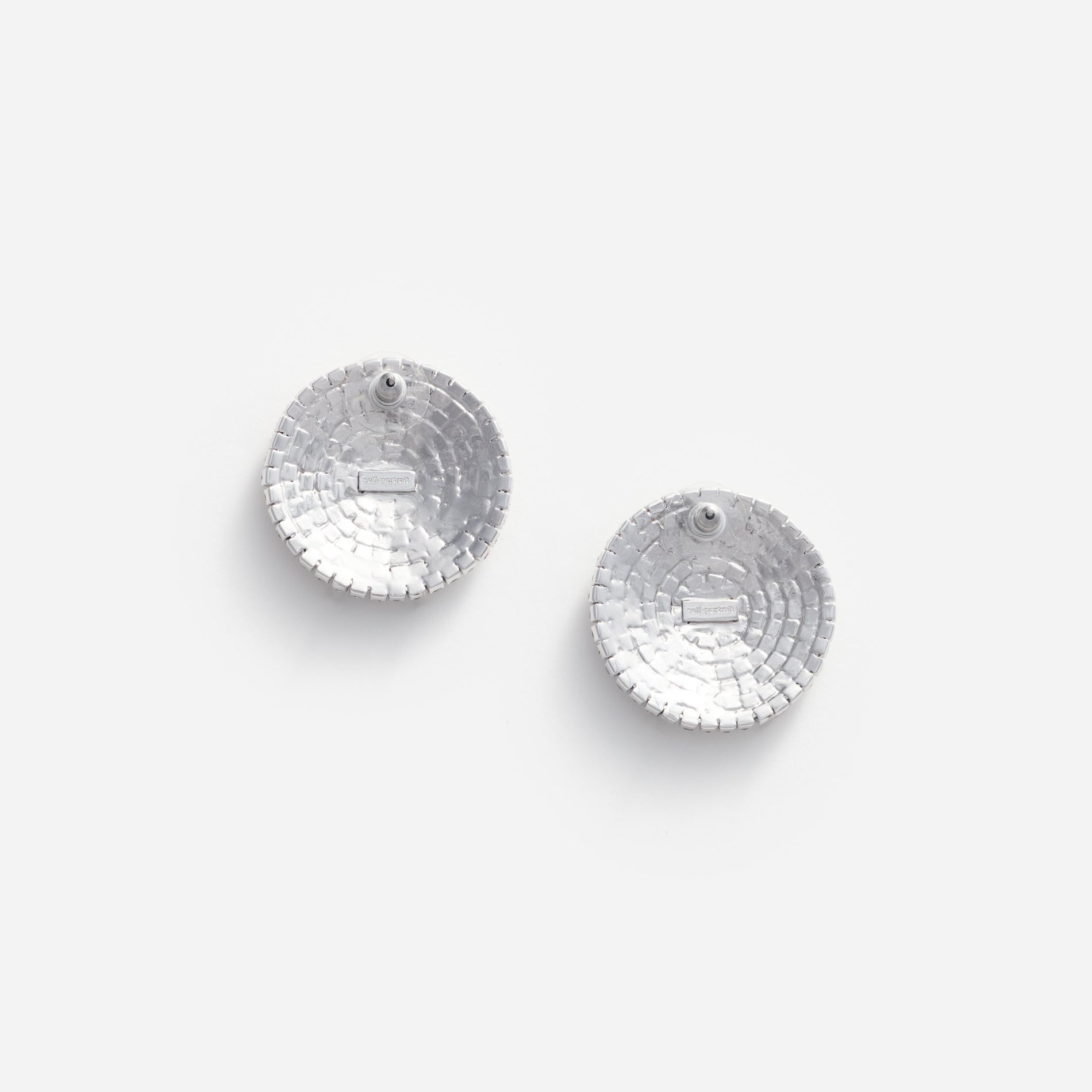 Side view of a woman wearing the Large Round Crystal Earrings