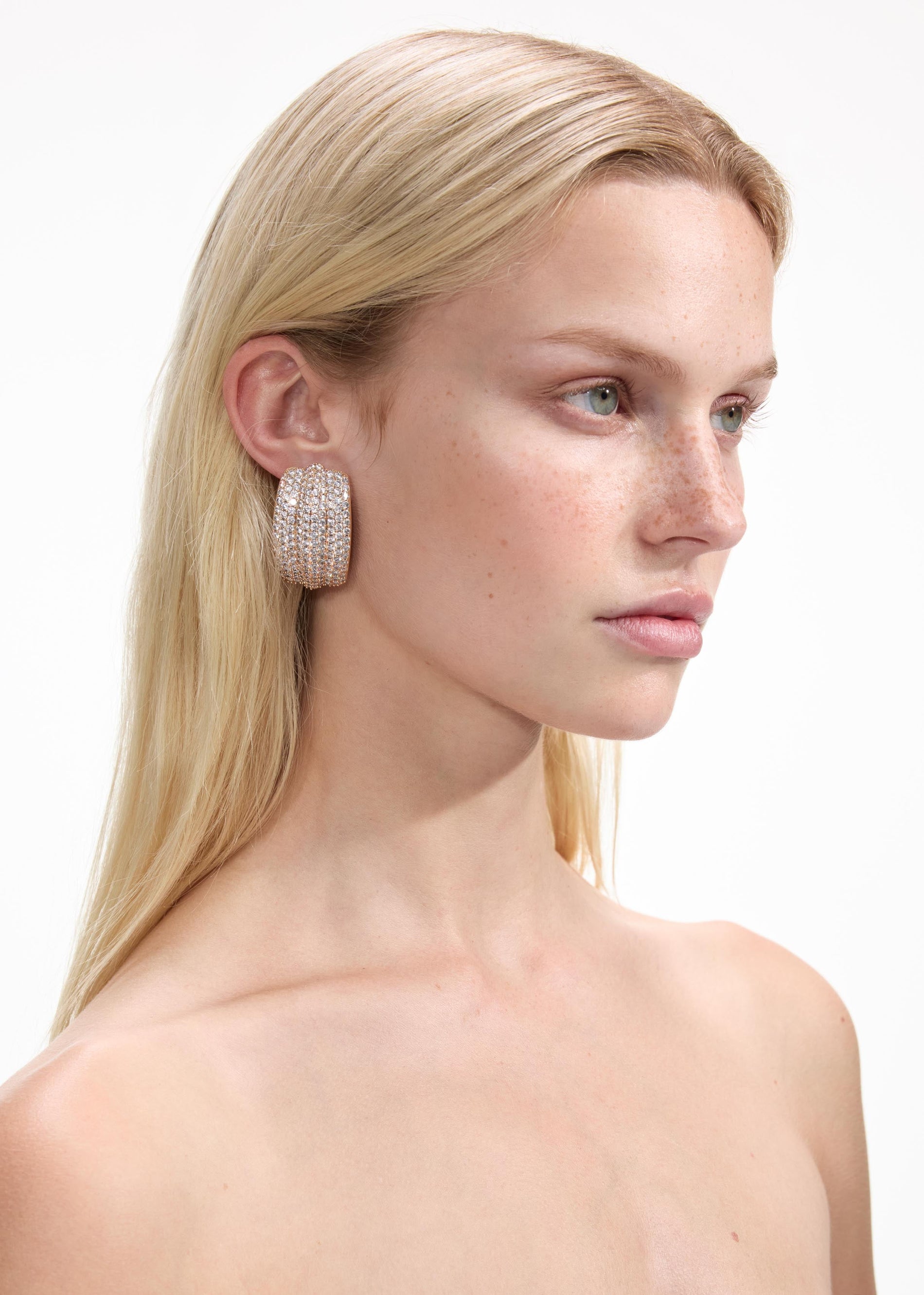 Back view of a woman wearing the Gold Crystal Ridged Earrings