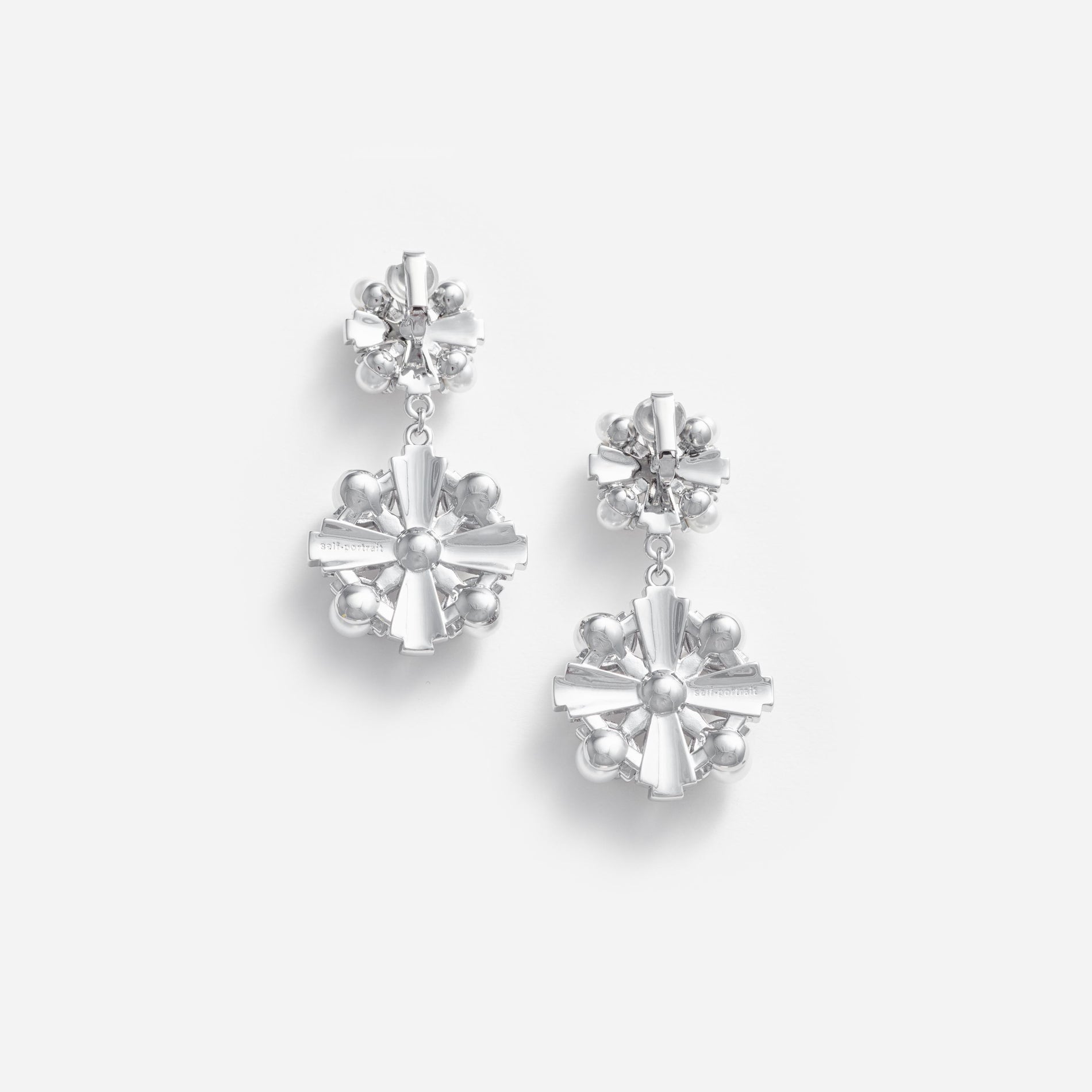 Side view of a woman wearing the Silver Encrusted Tiered Earrings