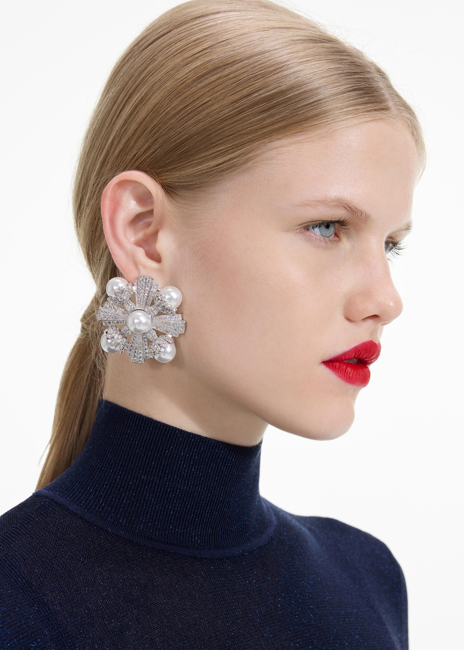 Back view of a woman wearing the Large Silver Encrusted Earrings