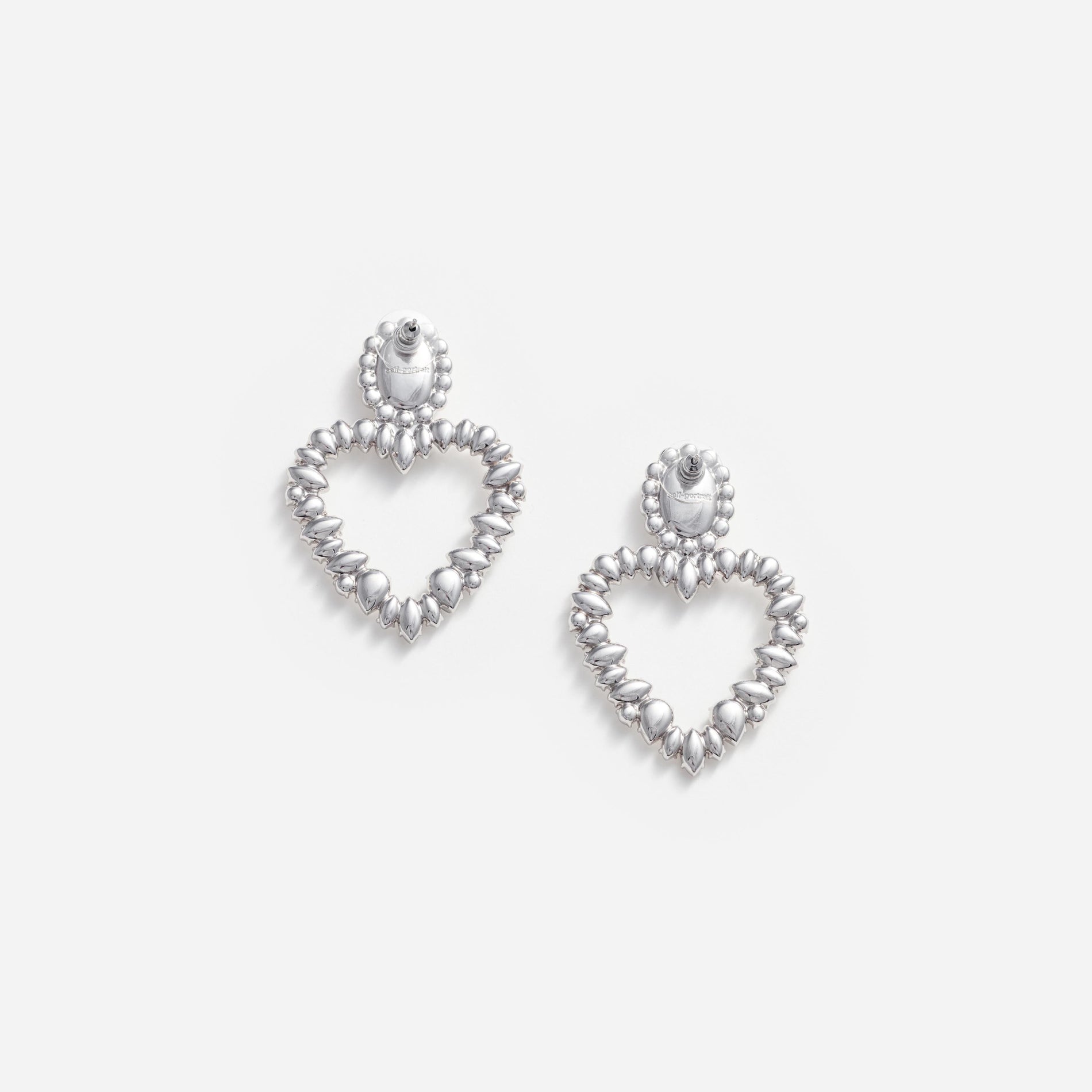 Side view of a woman wearing the Crystal Heart Earrings