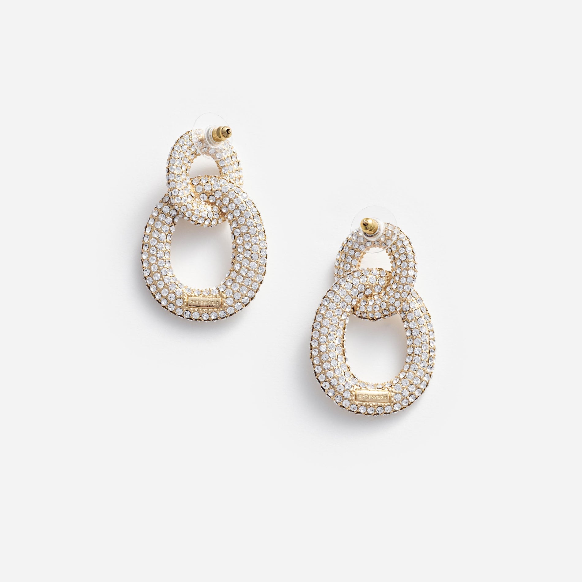 Side view of a woman wearing the Gold Crystal Link Earrings