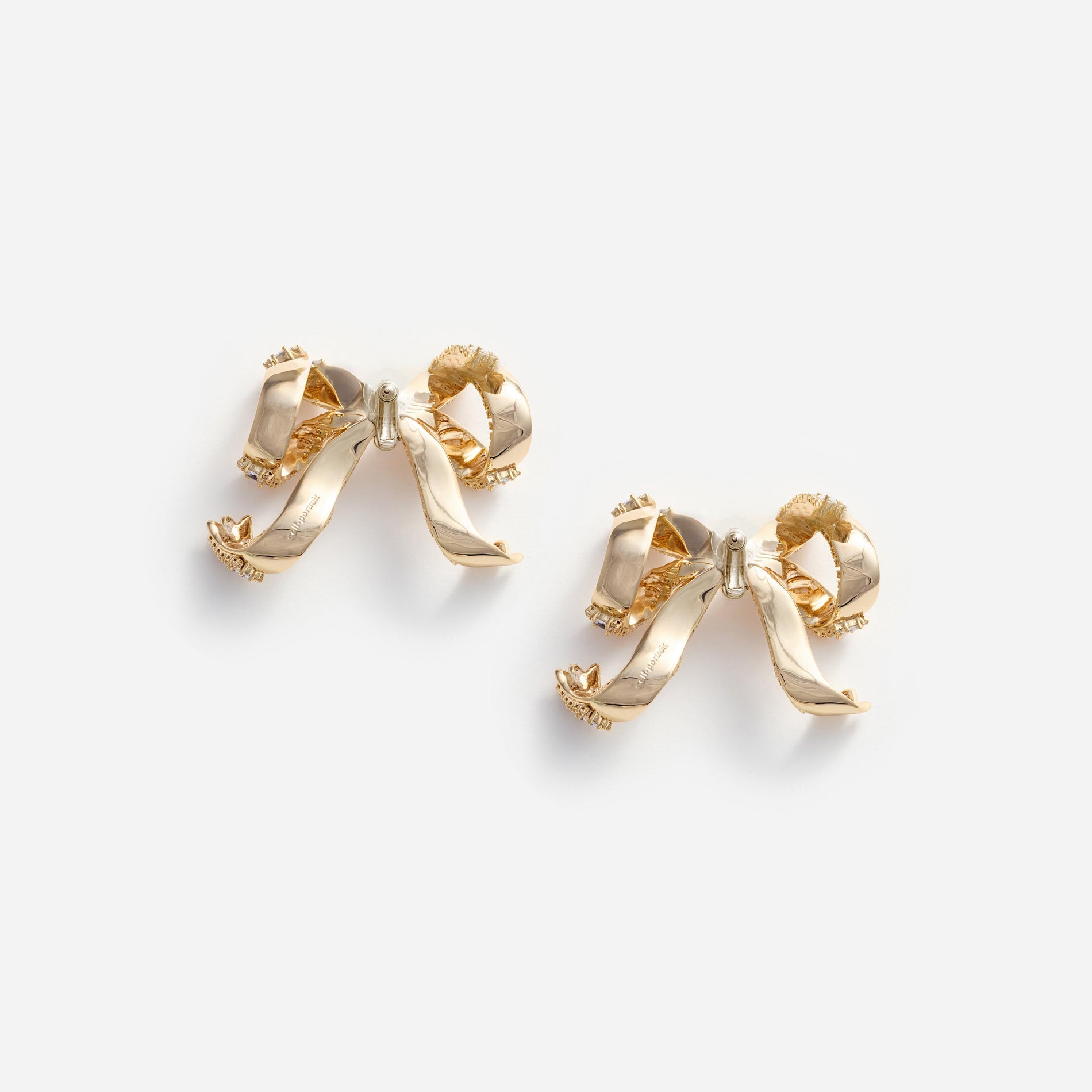 Side view of a woman wearing the Gold Crystal Bow Earrings