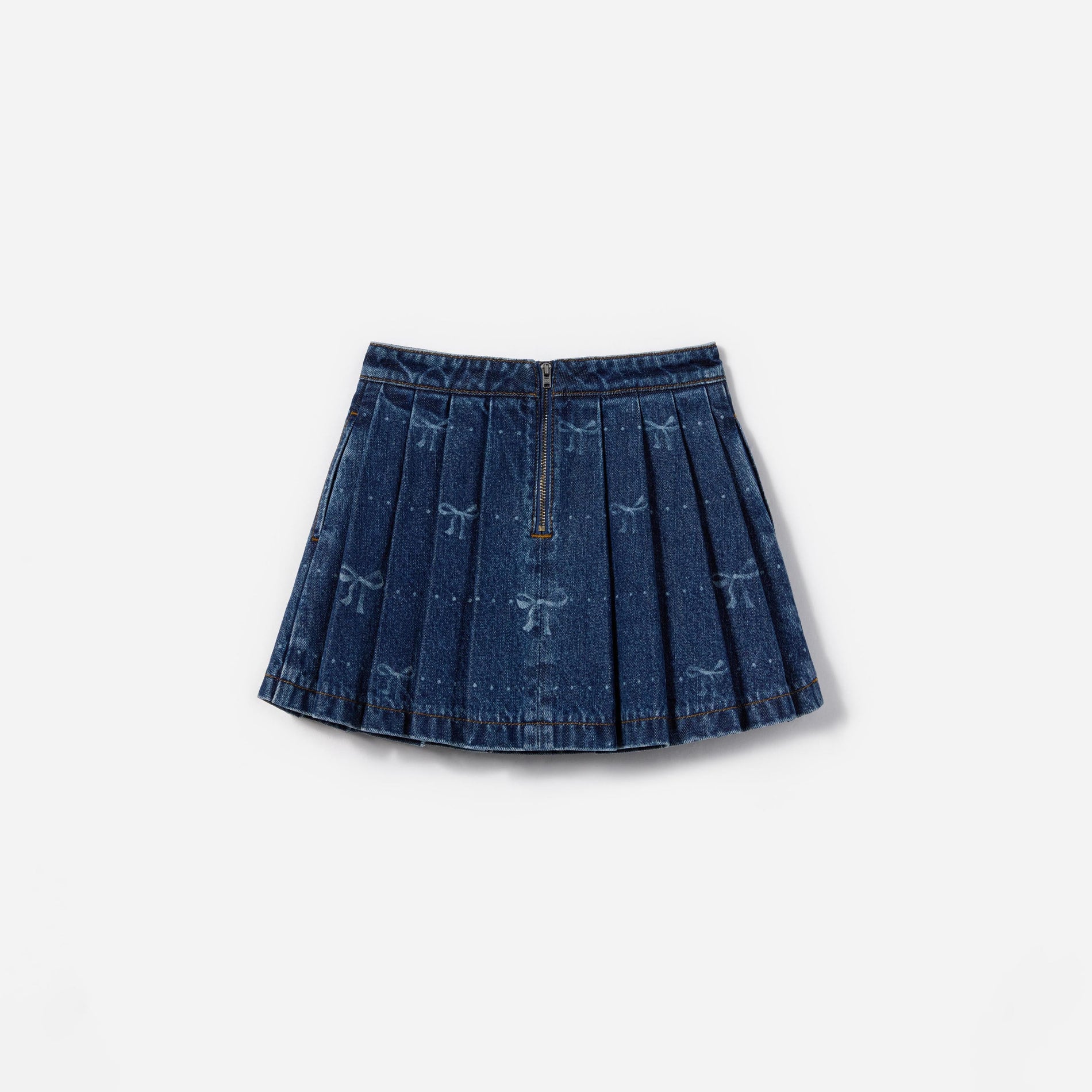 Side view of a woman wearing the Denim Bow Print Skirt