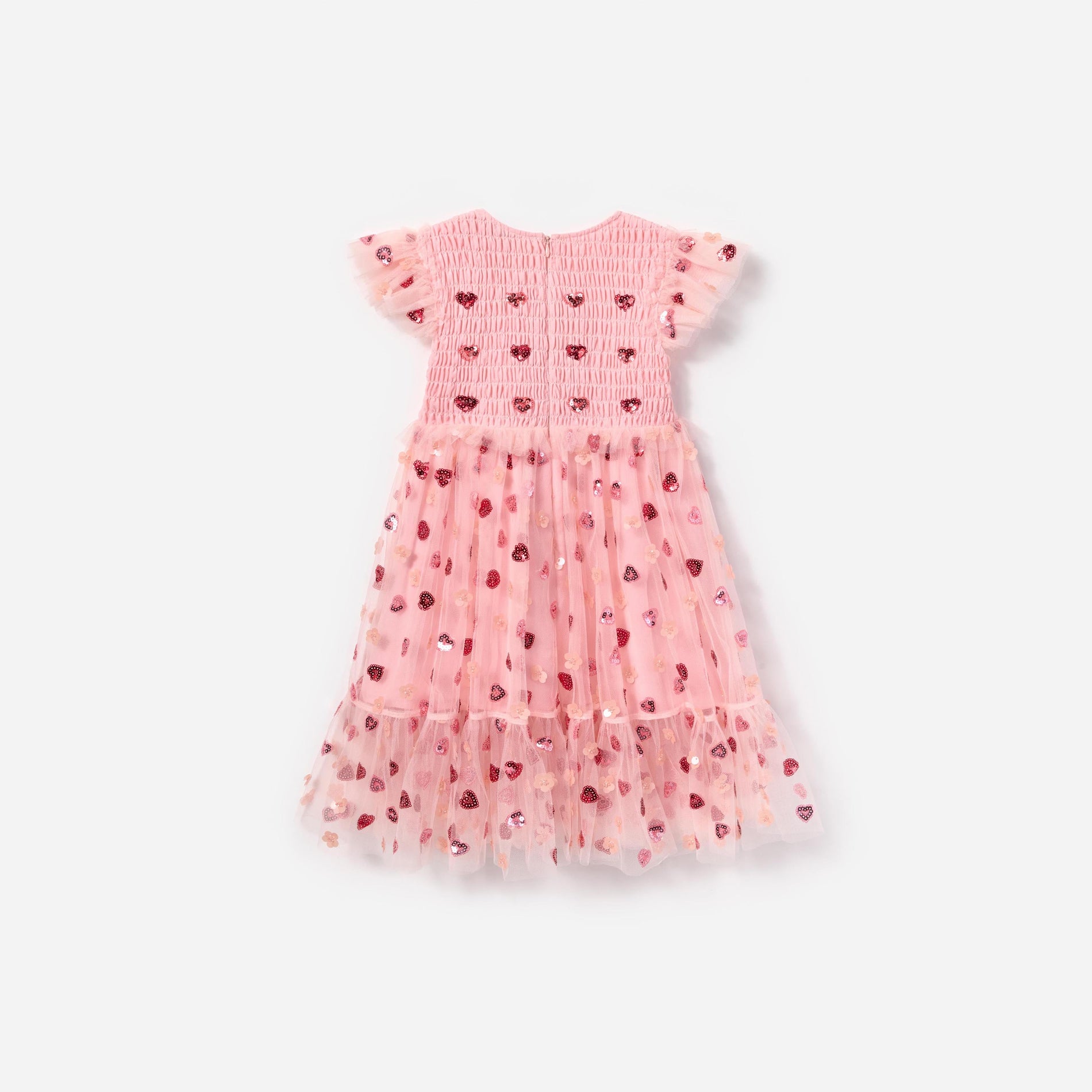 Side view of a woman wearing the Pink Mesh Heart Sequin Dress