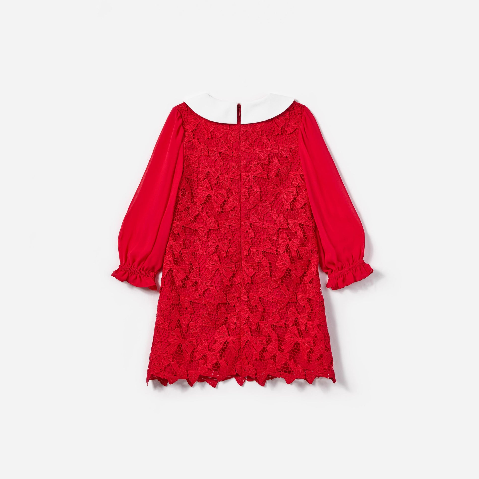 Side view of a woman wearing the Red Bow Lace Dress