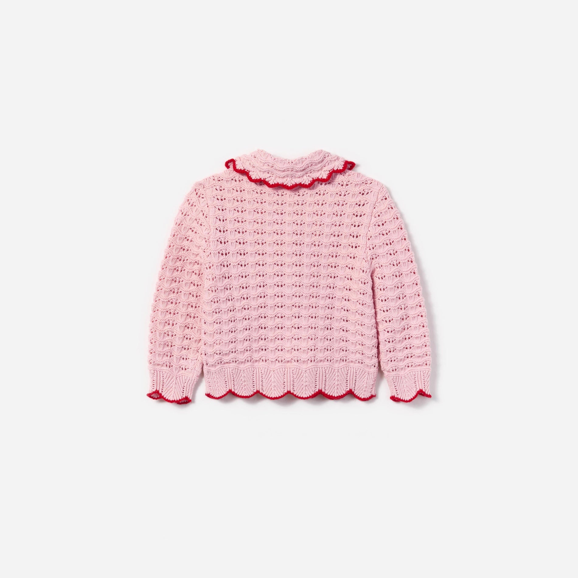 Side view of a woman wearing the Pink Textured Heart Detail Cardigan