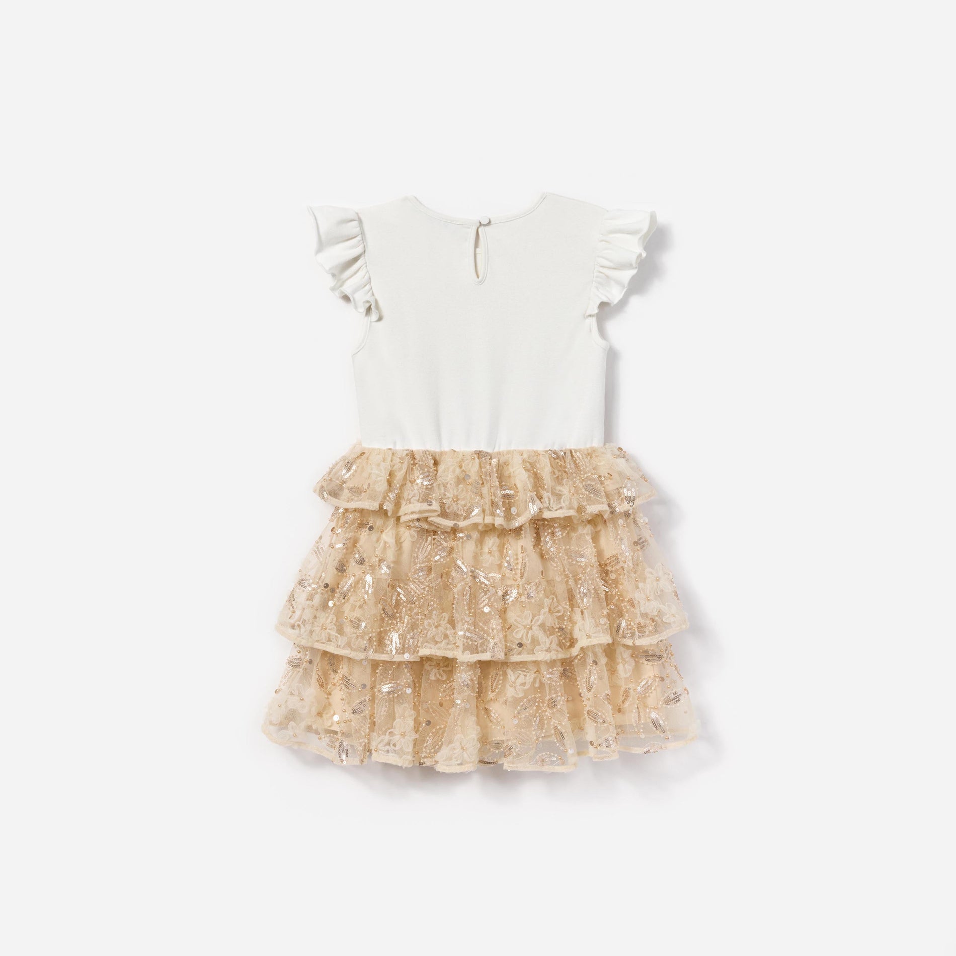 Side view of a woman wearing the Cream Jersey Sequin Tulle Dress