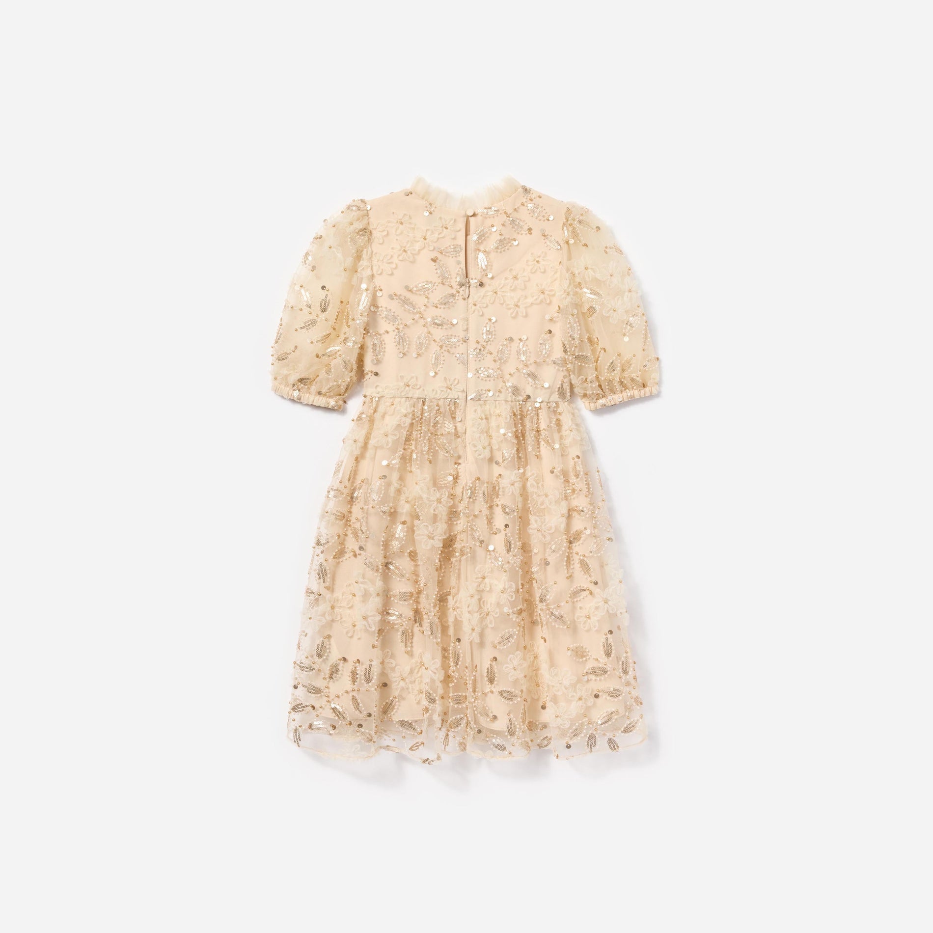 Side view of a woman wearing the Cream Sequin Tulle Dress