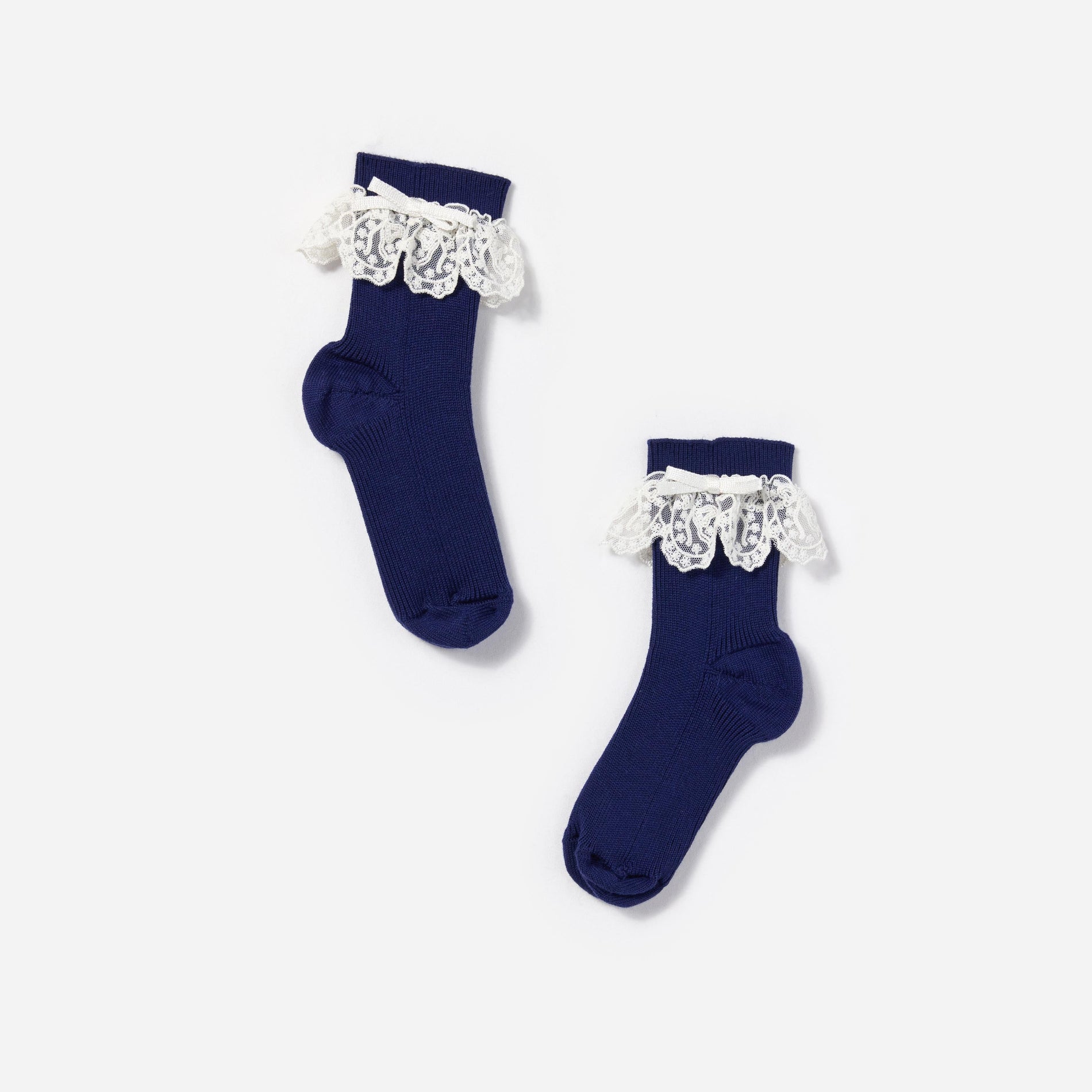 Side view of a woman wearing the Lace Trim Bow Socks
