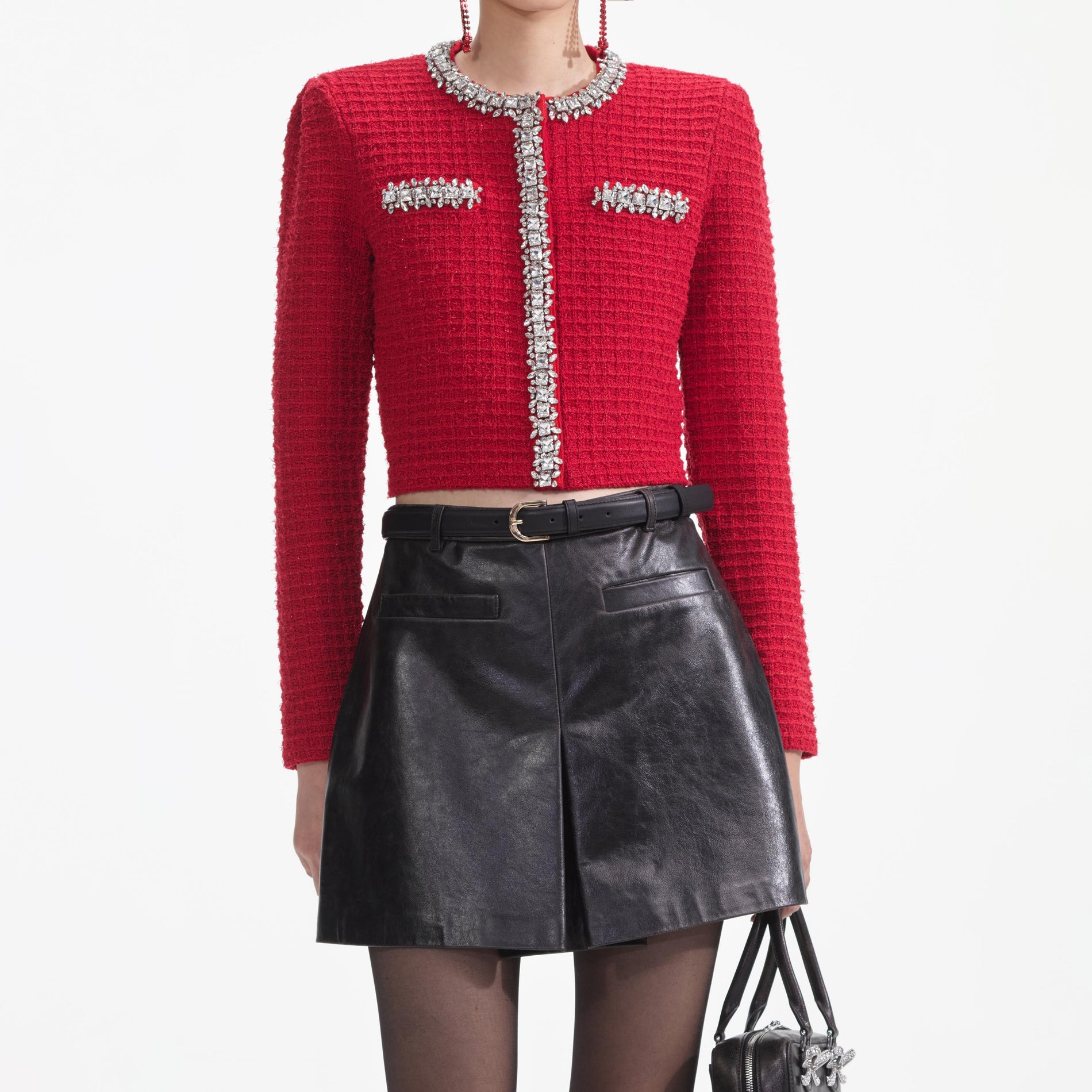 A close up of a woman wearing the Red Textured Knit Cardigan