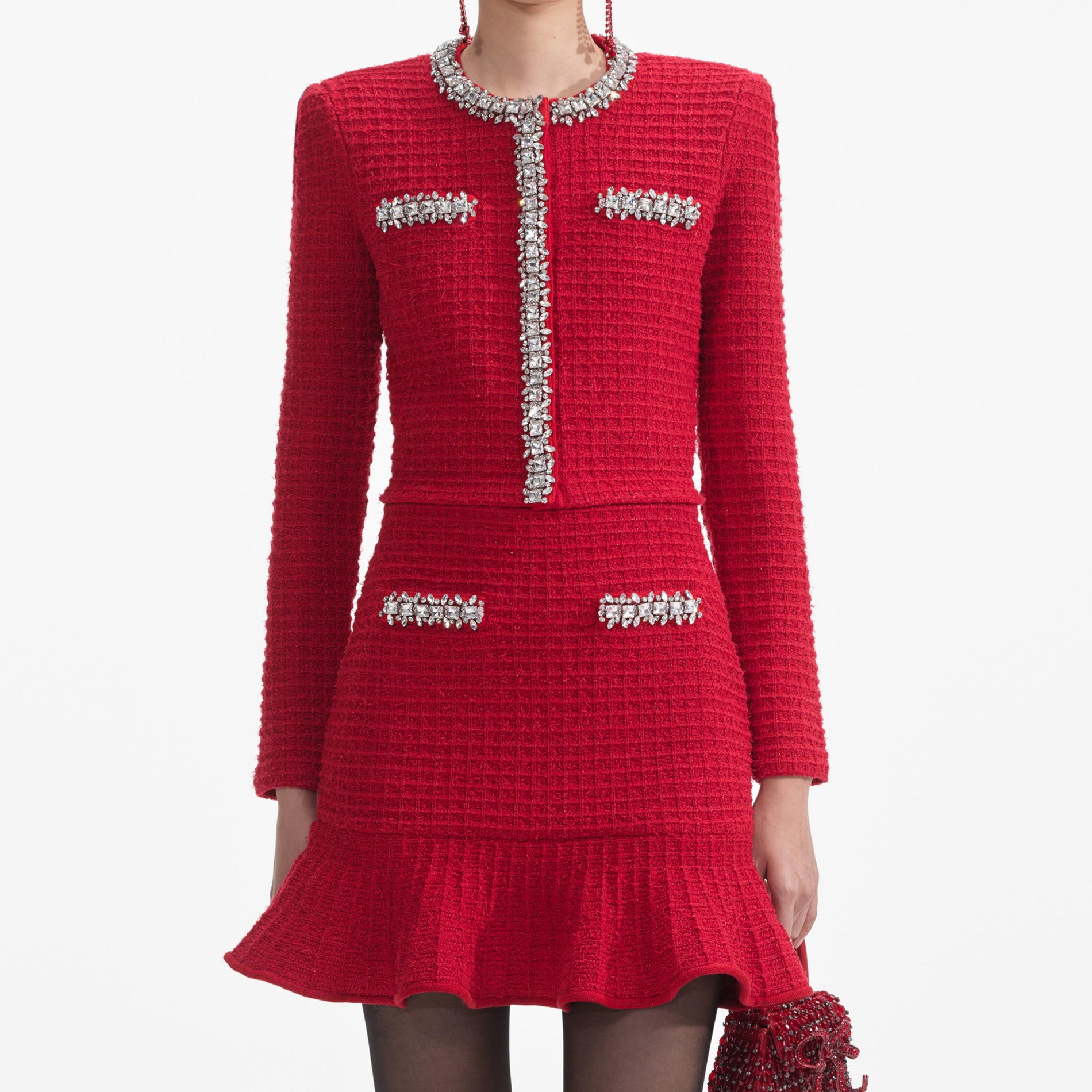 A close up of a woman wearing the Red Textured Knit Mini Skirt